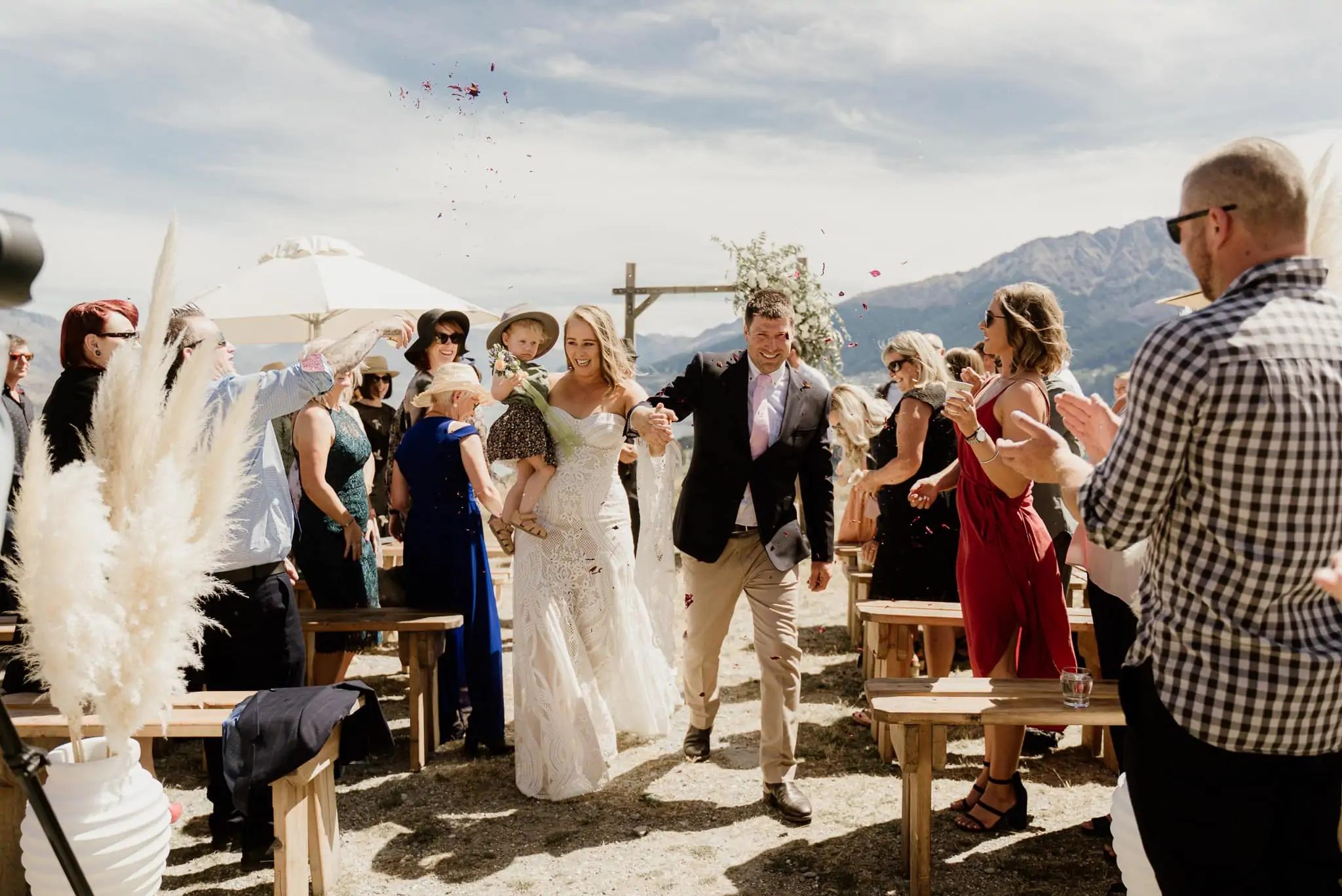 A couple walking down the aisle at an intimate elopement wedding in New Zealand.