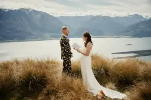Saniya and Steve's wedding preview featuring a mountain and lake view.