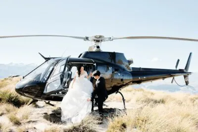 Ayaka Morita's portfolio featuring a bride and groom near a helicopter.