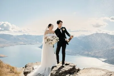 A couple's mountain-top wedding overlooking Lake Wanaka, captured in Tracy & Markus' Cecil Peak Heli Wedding Previews.