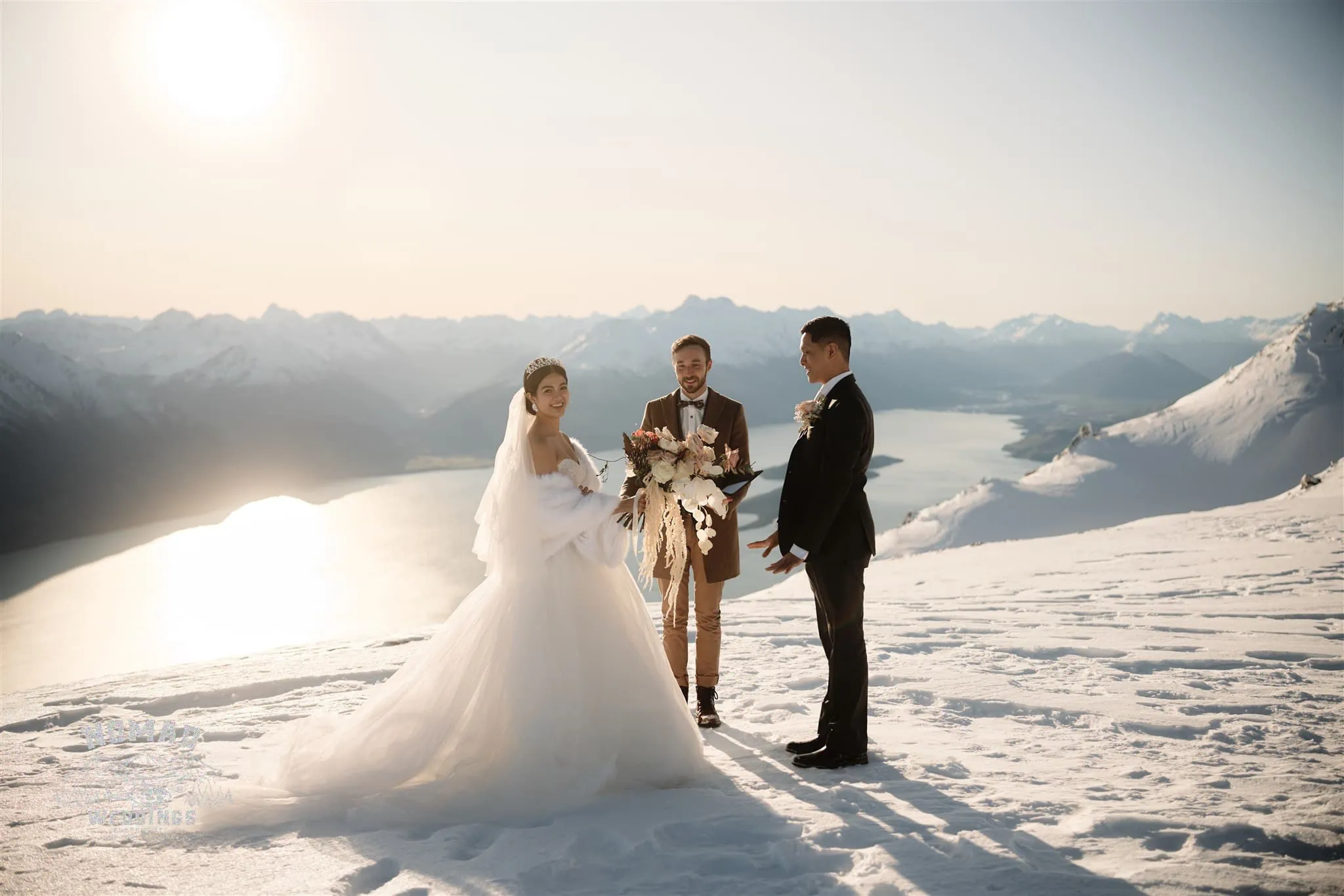 A couple's snowy mountaintop wedding at Mt Creighton in Queenstown, NZ.