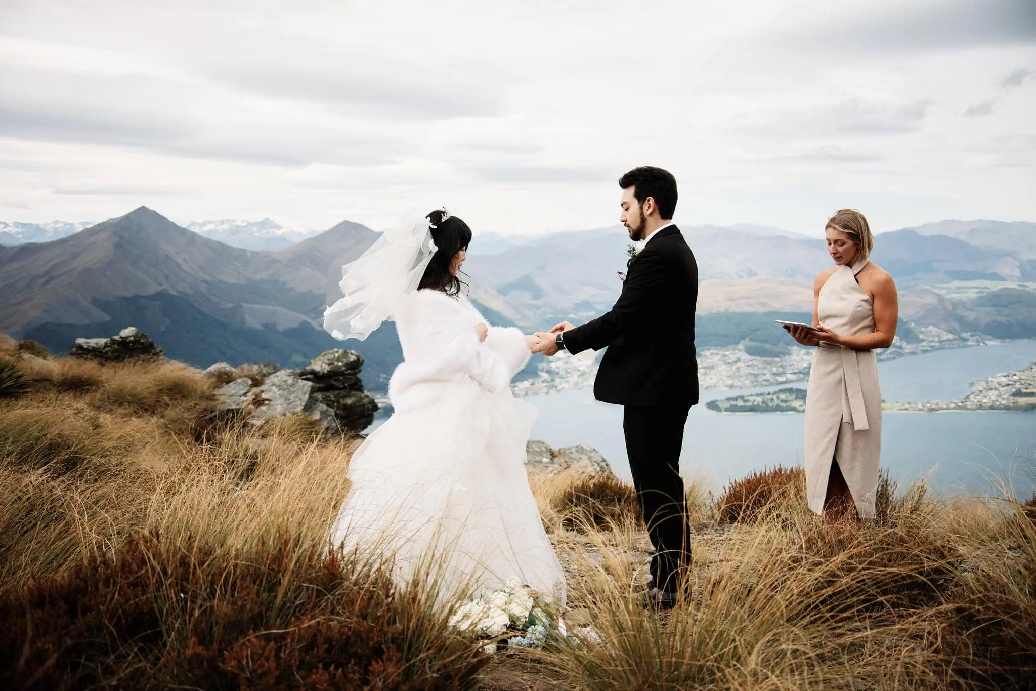 Carlos and Wanzhu share intimate vows atop Cecil Peak in Queenstown, New Zealand.