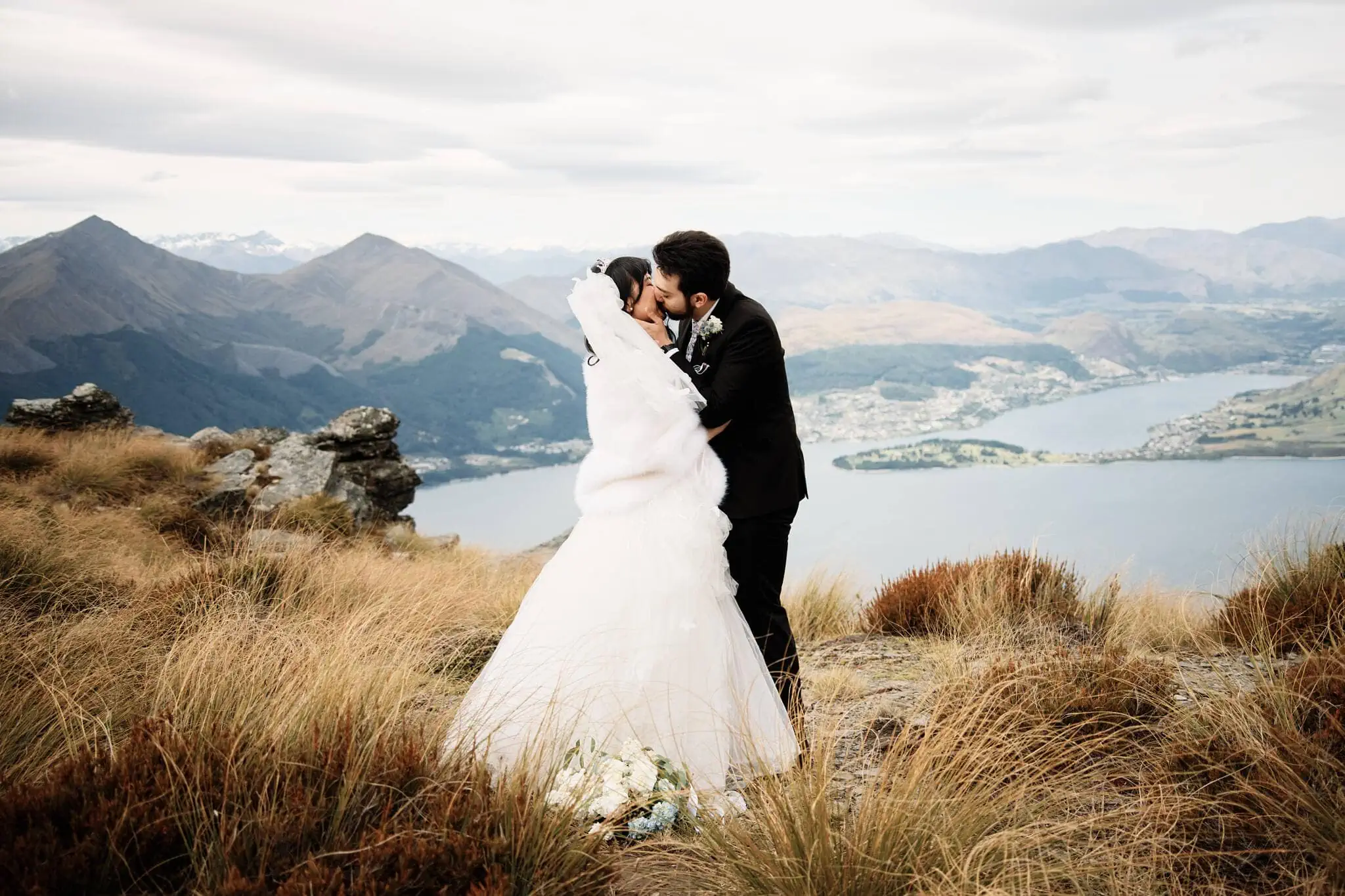 Carlos and Wanzhu's intimate elopement wedding on Cecil Peak overlooking Lake Wanaka.