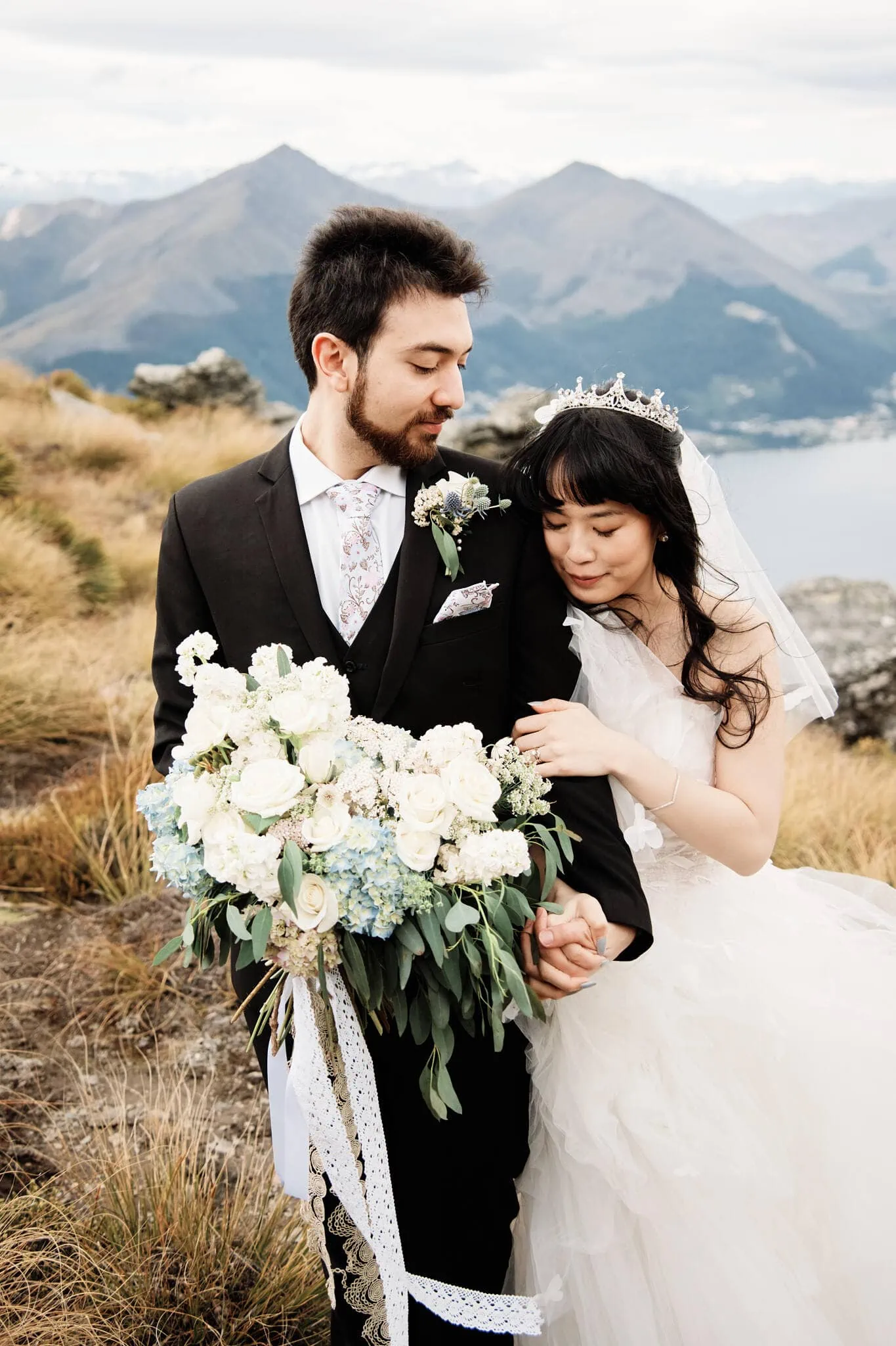 Carlos and Wanzhu's intimate heli elopement wedding atop Cecil Peak with a breathtaking view of Lake Wanaka.