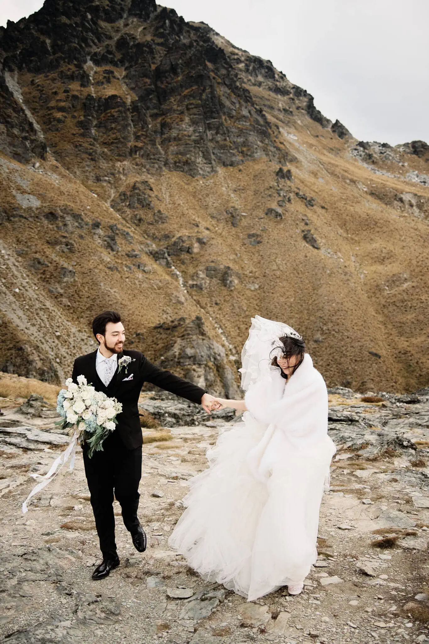 Carlos and Wanzhu's intimate elopement wedding in front of majestic mountains.