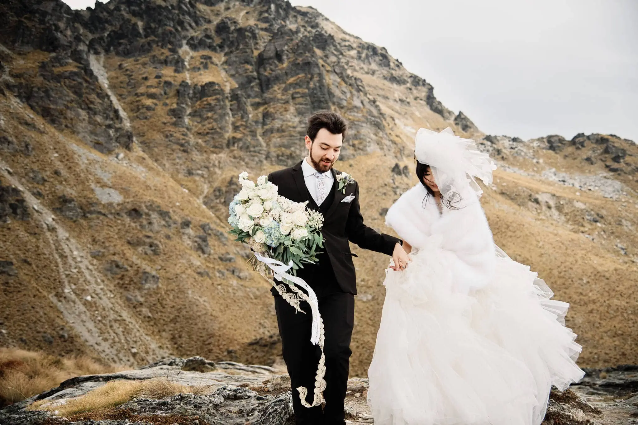 Carlos and Wanzhu's intimate heli elopement wedding on Cecil Peak mountain.