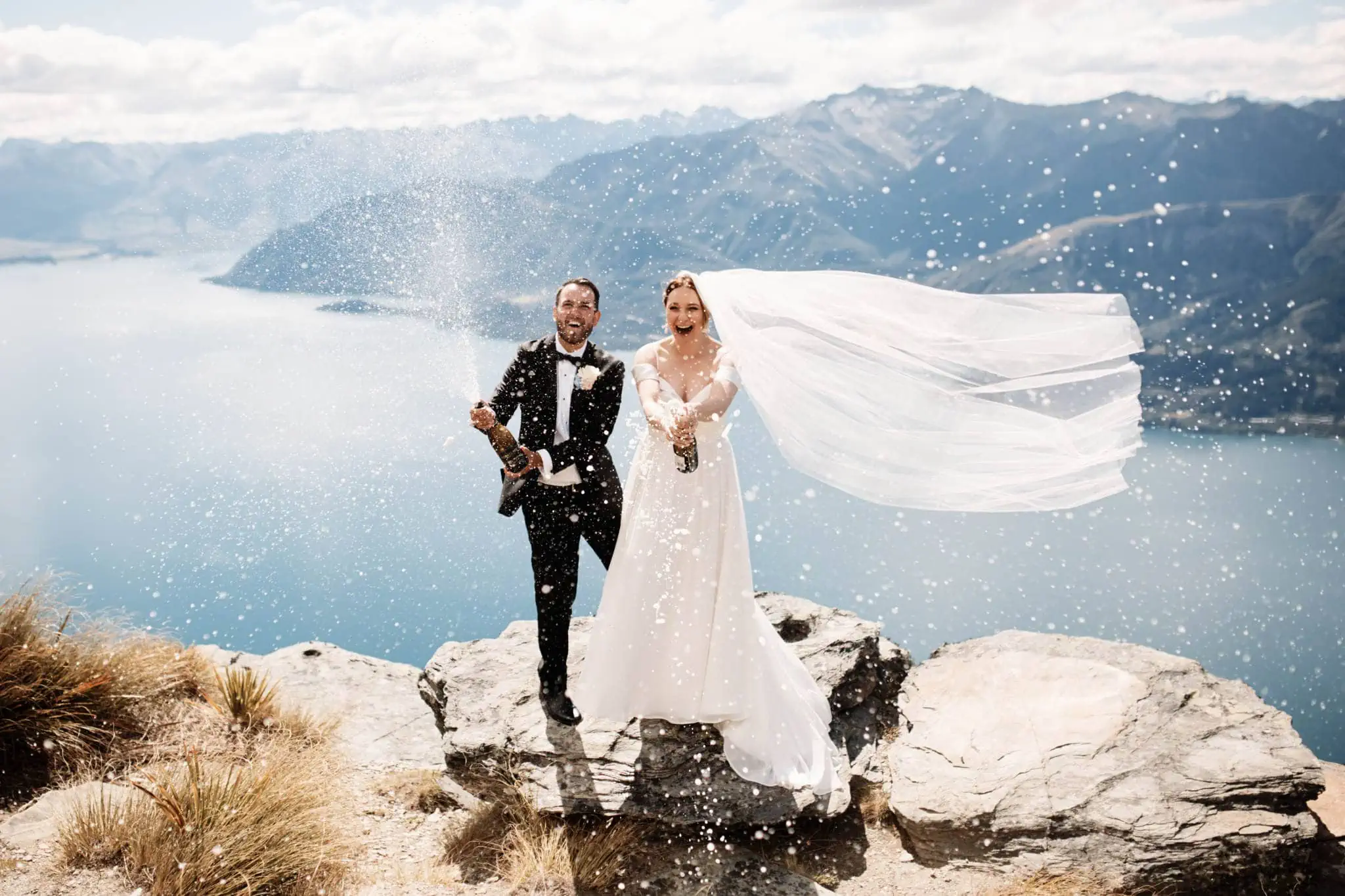 Sapphire and JJ's Queenstown Heli Elopement Wedding on top of a mountain overlooking Lake Wanaka.