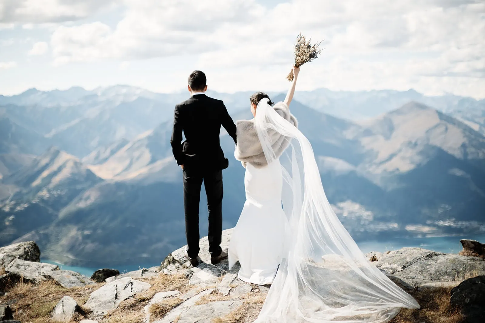 Dios & Carlyn's Queenstown Heli Pre Wedding adventure at Cecil Peak, with breathtaking mountainous backdrop.