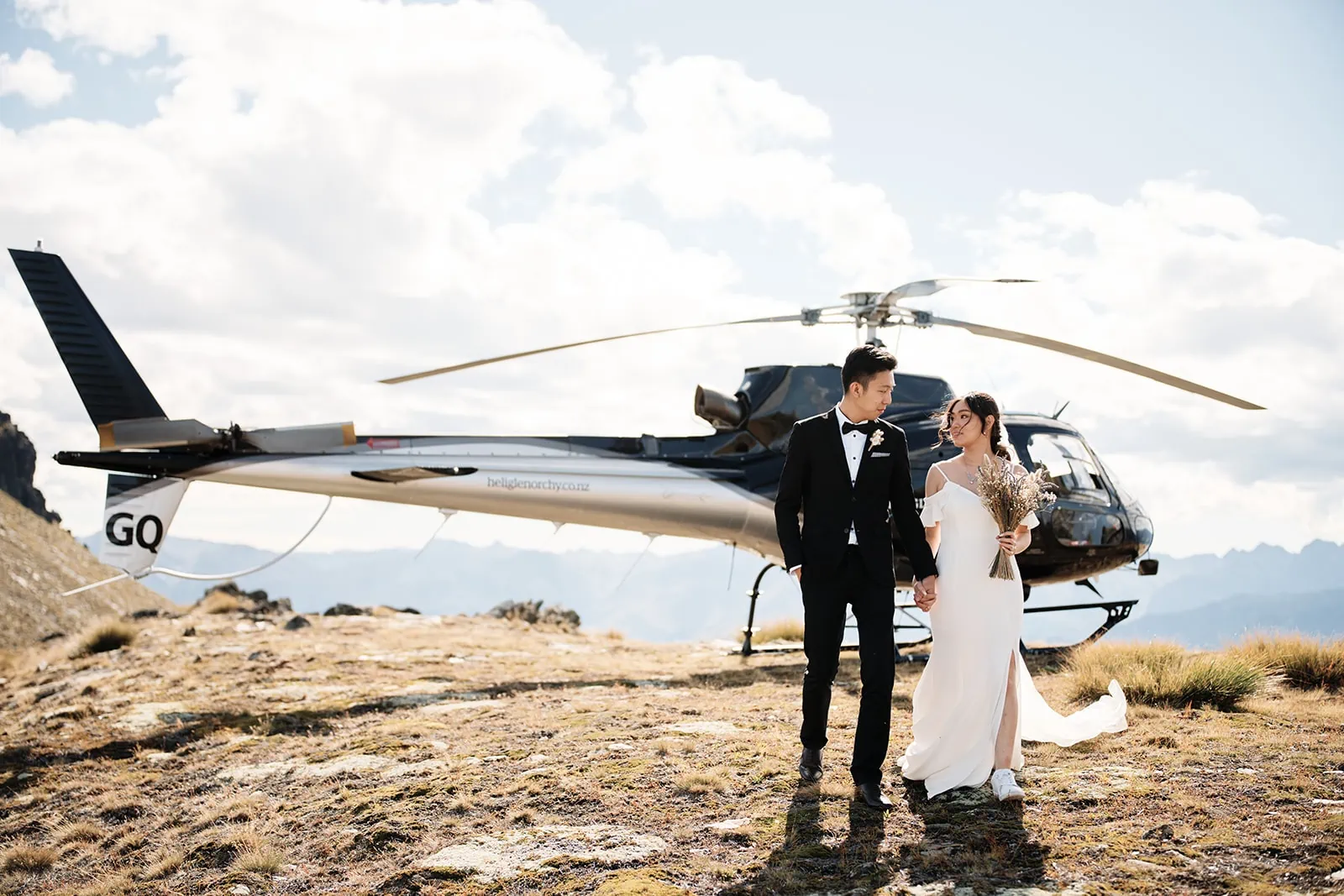 A picturesque pre-wedding shoot featuring Dios and Carlyn in Queenstown, with a stunning helicopter backdrop at Cecil Peak.