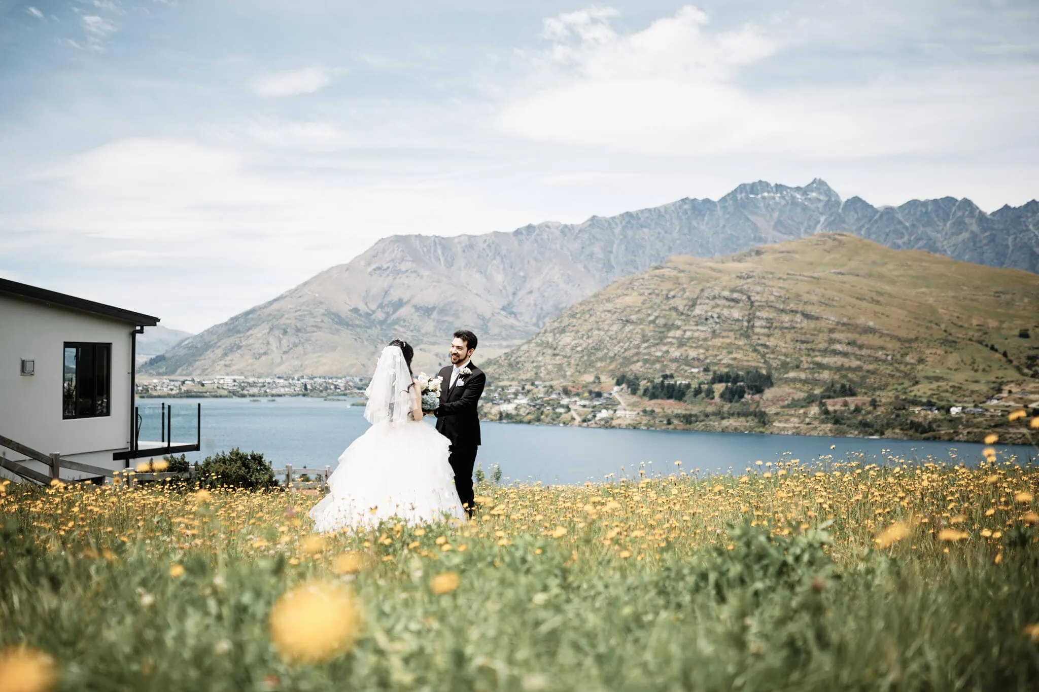 Carlos and Wanzhu's intimate heli elopement wedding, with mountains in the background.