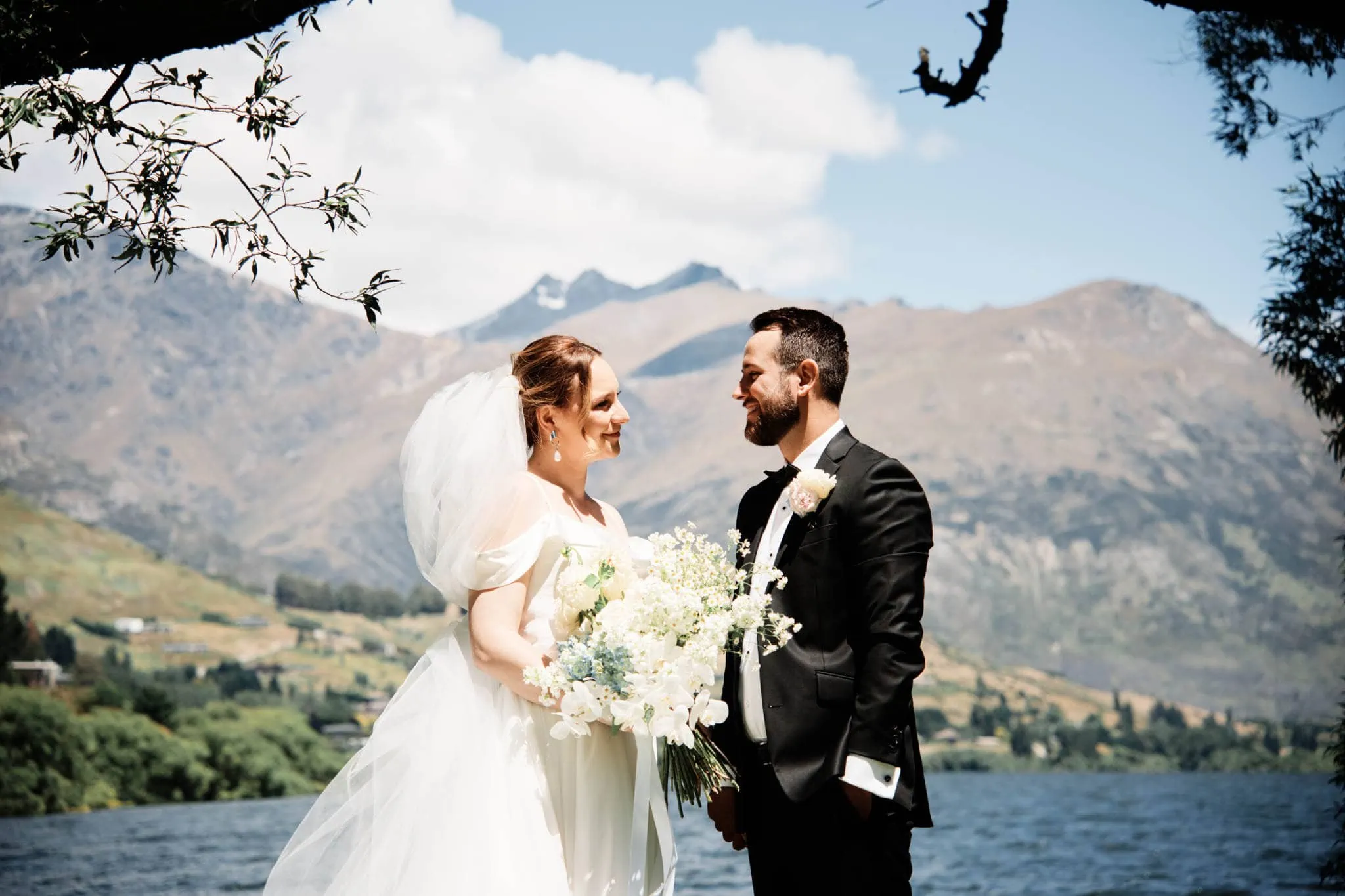 Sapphire and JJ's Queenstown Heli Elopement Wedding with a breathtaking lake and mountain backdrop.