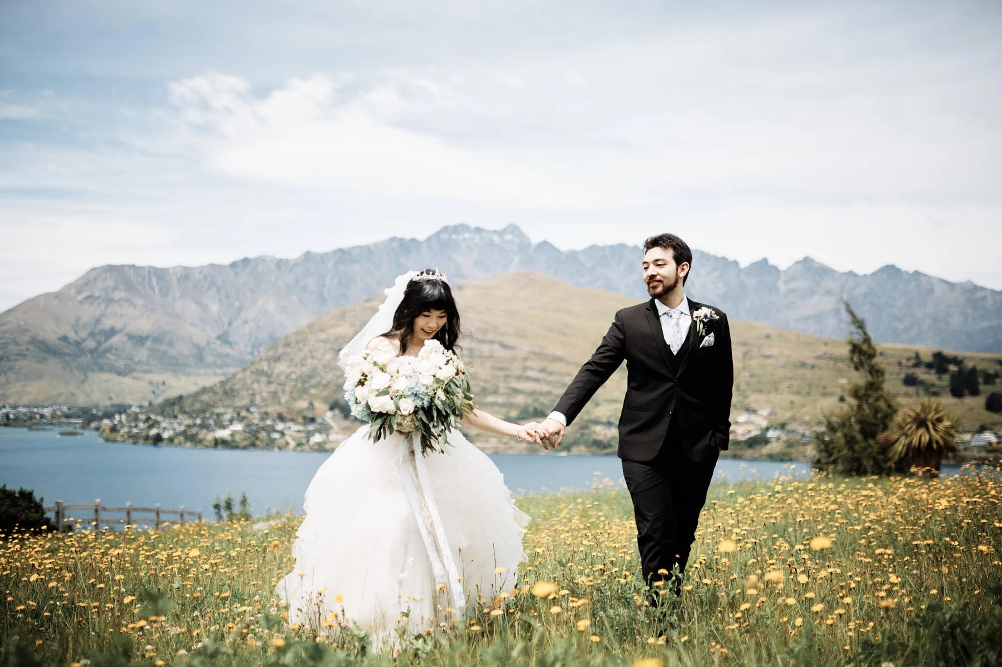Carlos and Wanzhu sharing an Intimate Helicopter Elopement Wedding with stunning mountain backdrop.