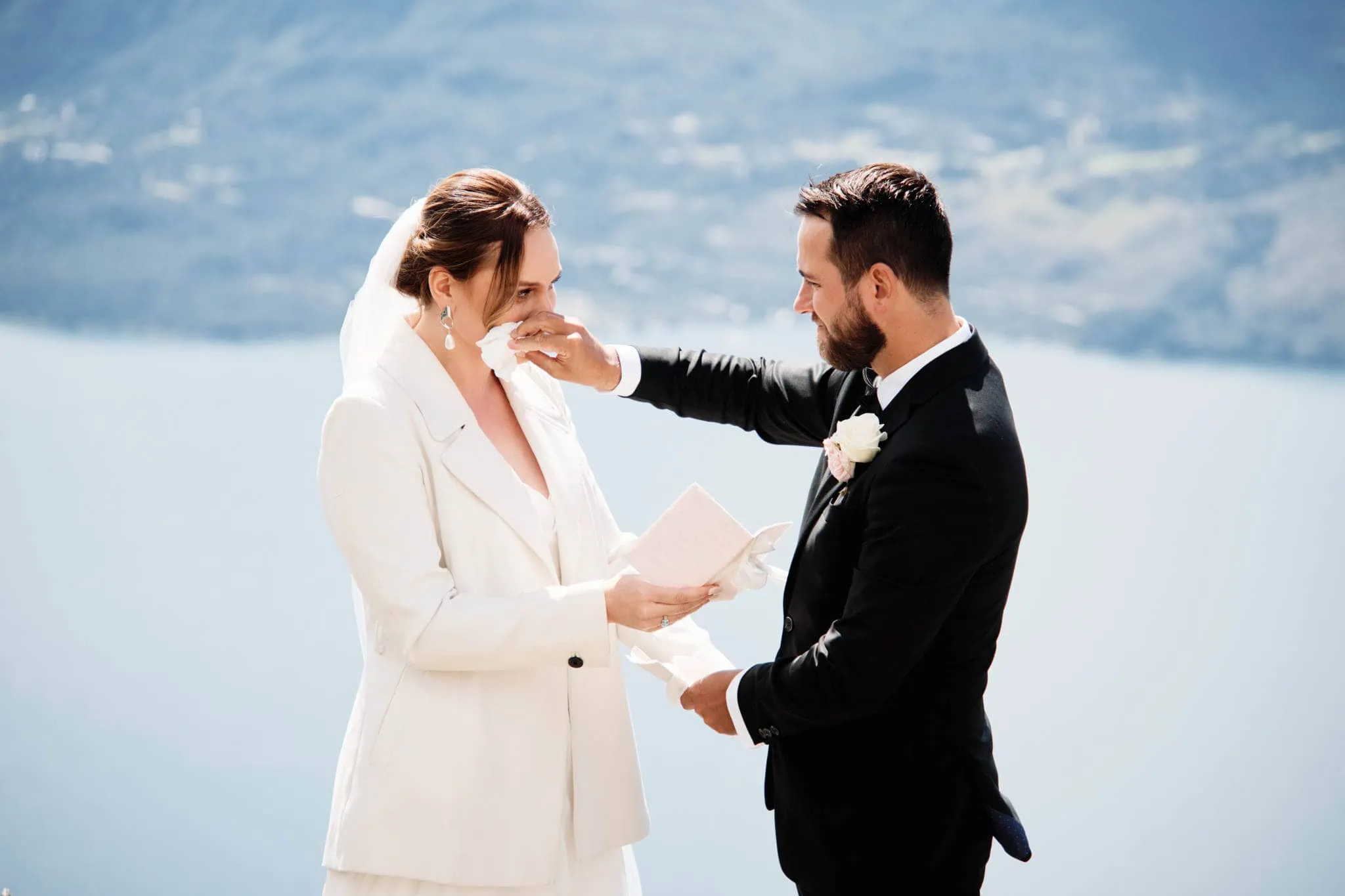 A Sapphire and JJ couple have a Queenstown Heli Elopement Wedding on top of a mountain overlooking Lake Como.