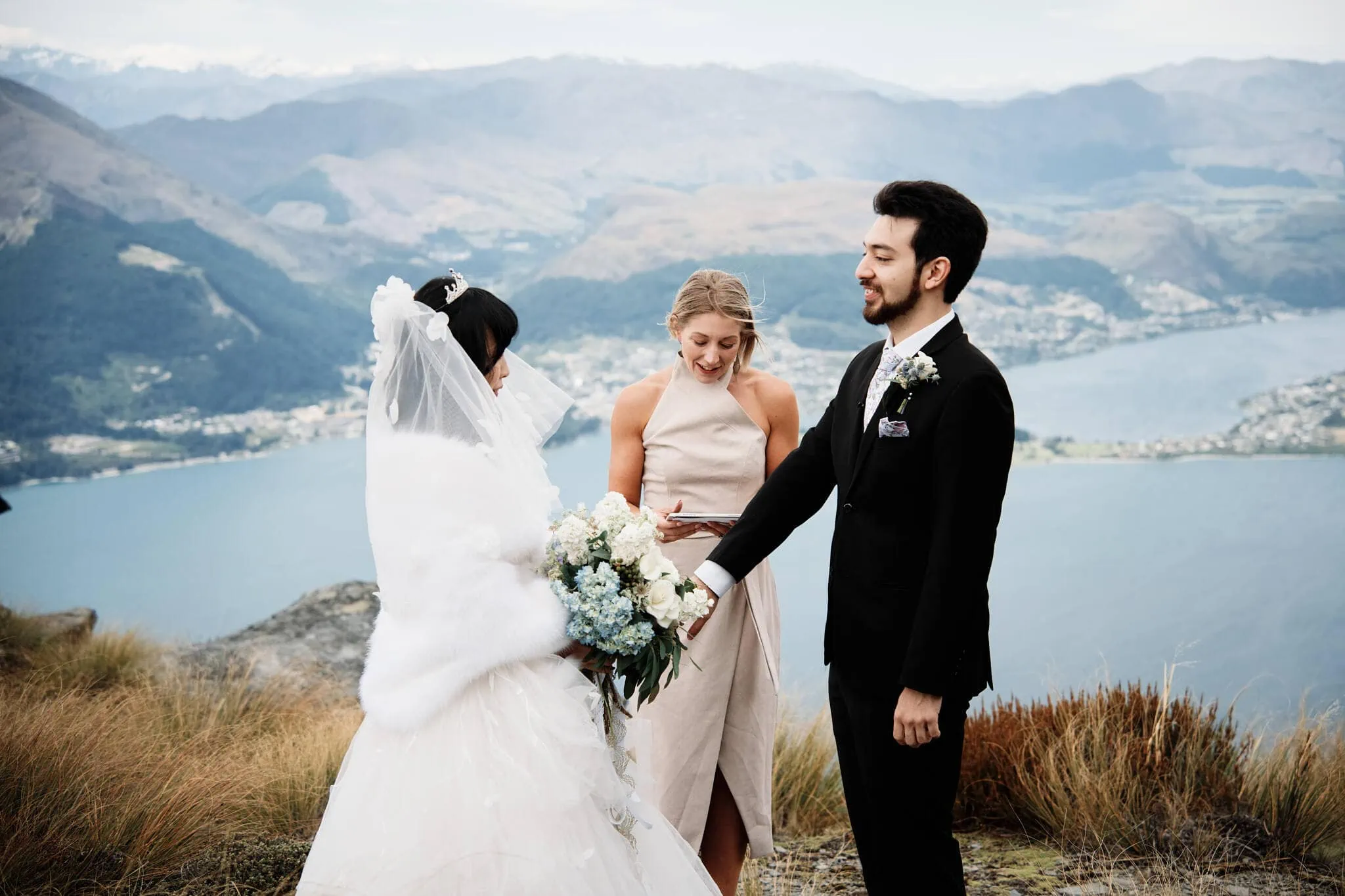 Carlos and Wanzhu have an intimate Cecil Peak heli elopement wedding on top of a mountain in Queenstown, New Zealand.