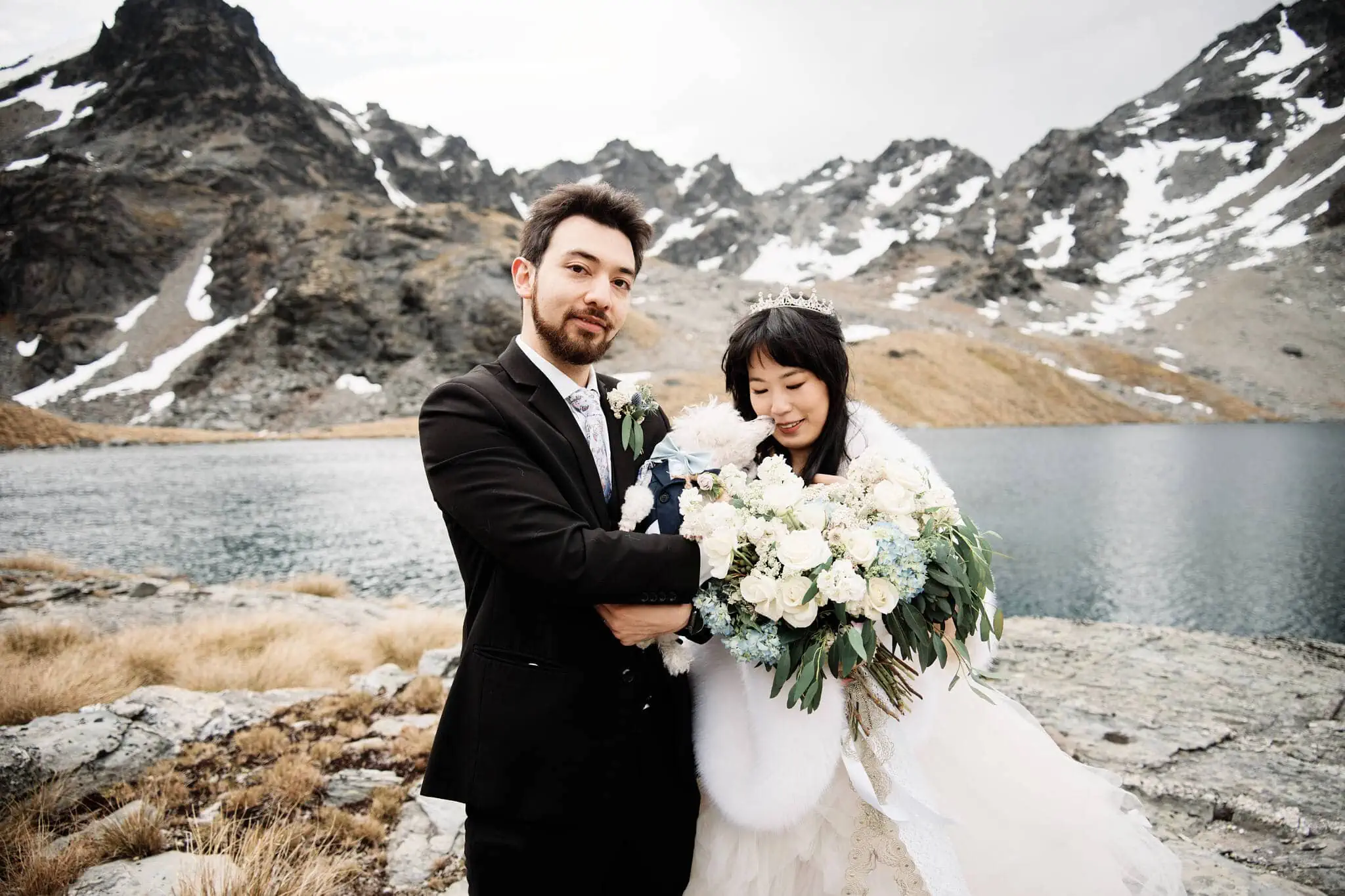 Carlos and Wanzhu's intimate elopement wedding in front of a lake.
