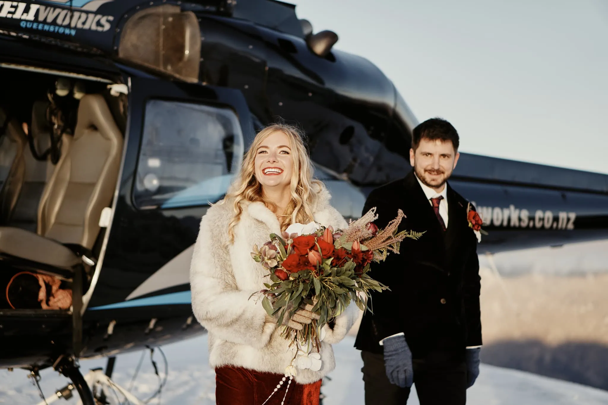 Claire and Rob soaring in an epic heli elopement wedding at Cecil Peak.