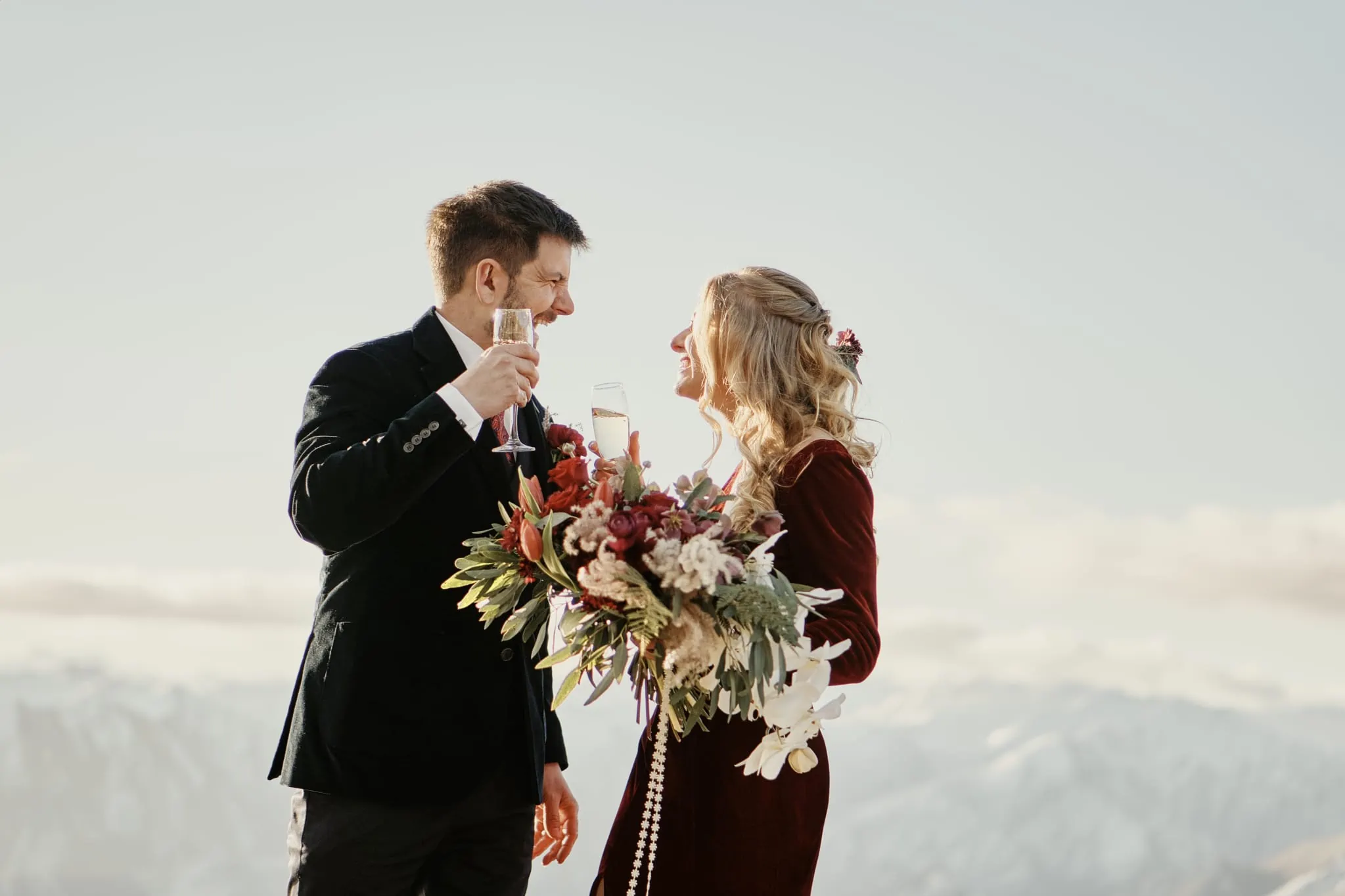 Claire and Rob toast during their Heli Elopement Wedding at Cecil Peak in New Zealand.