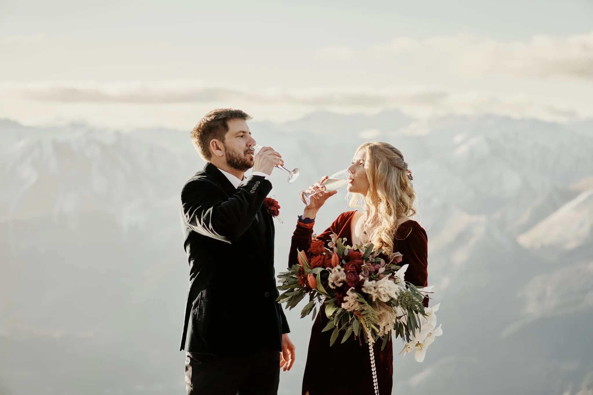 Claire and Rob's heli elopement wedding on Cecil Peak includes wine and breathtaking views.