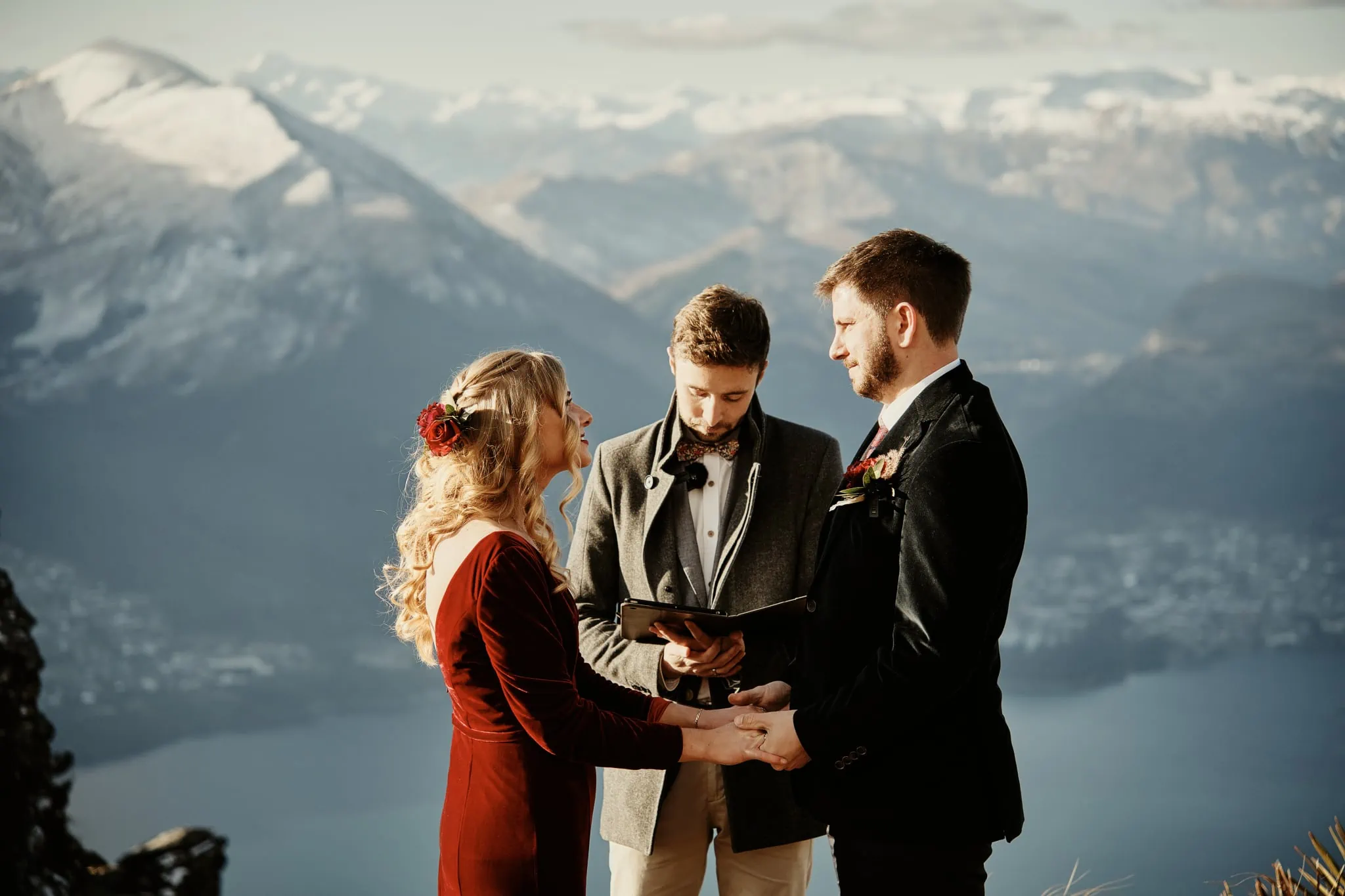Claire and Rob exchange vows on top of Cecil Peak in Queenstown, New Zealand for their heli elopement wedding.