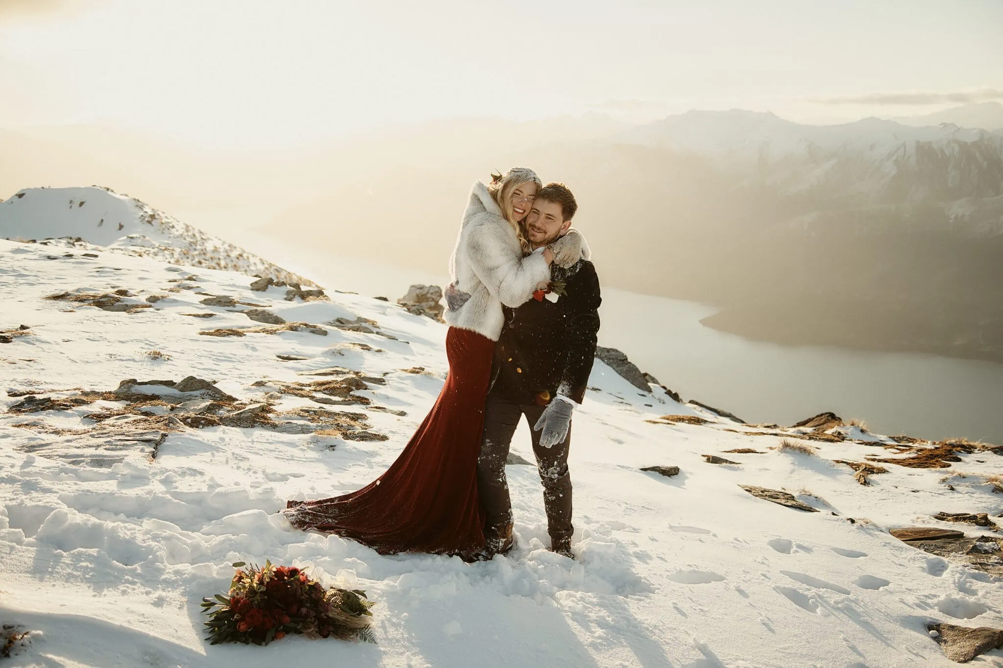 Claire and Rob's heli elopement wedding atop snow-covered Cecil Peak.