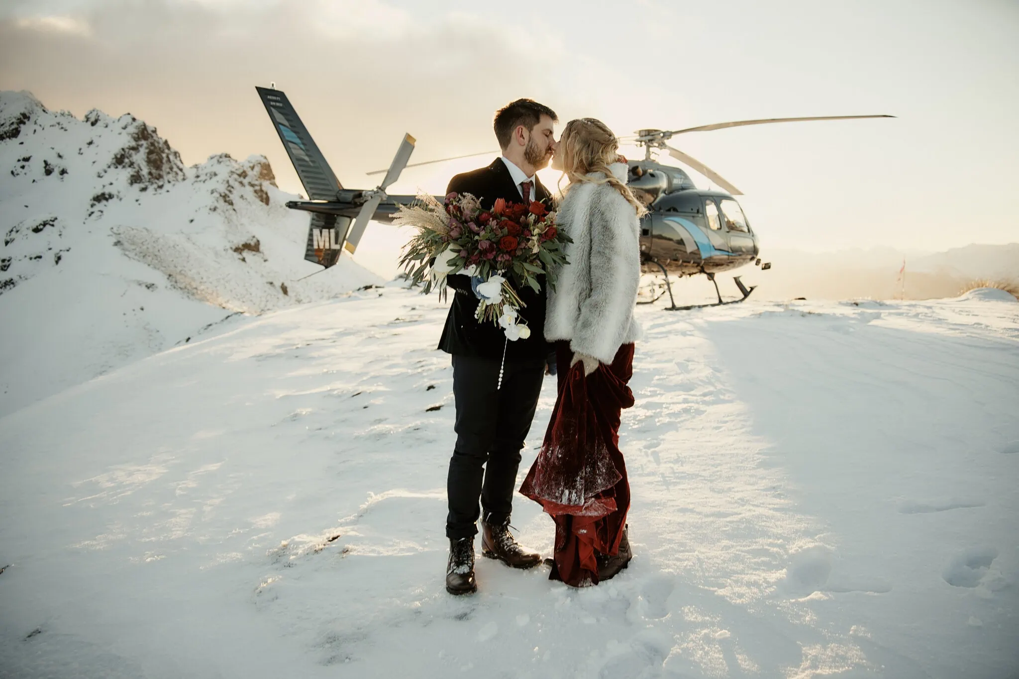 Keywords used: Claire and Rob, heli elopement wedding

Description: Claire and Rob share a kiss during their intimate heli elopement wedding.
