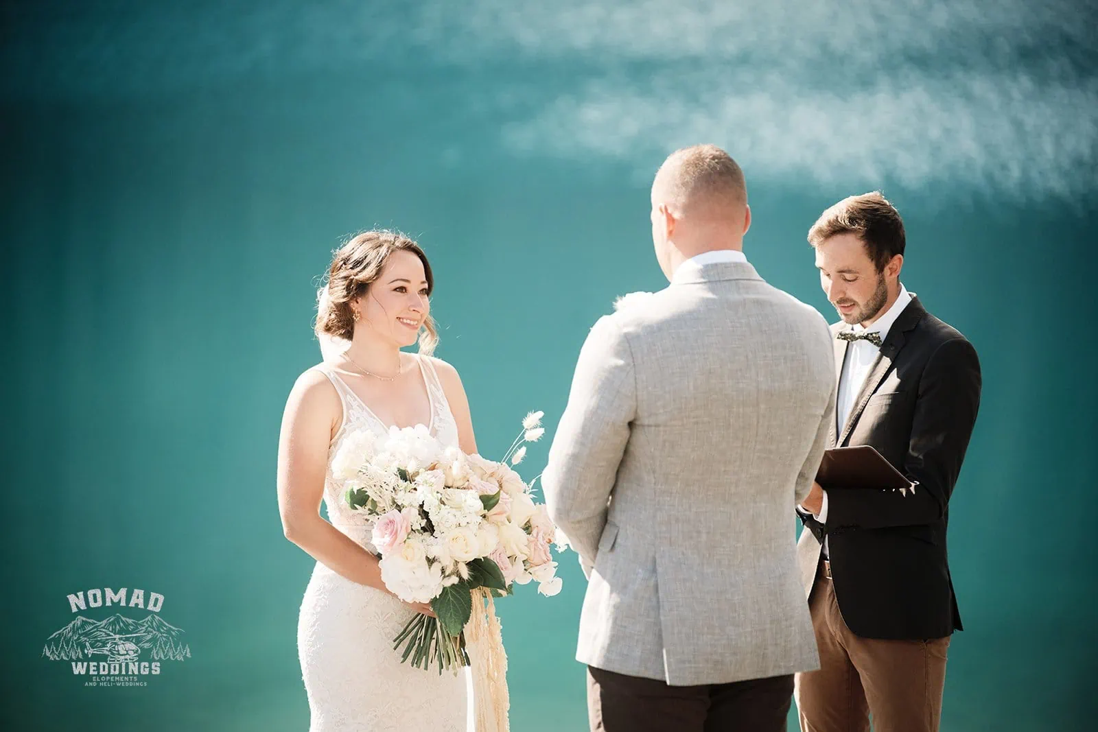 Amy & Eden exchange vows in front of Enchanting Lake Erskine.