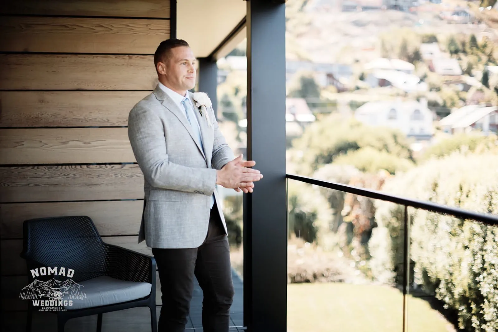 A man in a suit on an enchanting balcony.