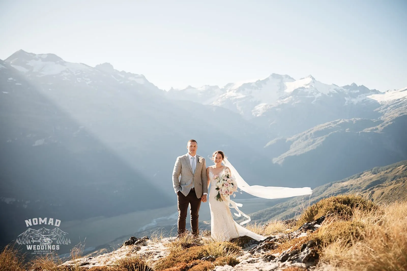 Enchanting Amy & Eden heli elopement wedding atop a mountain in New Zealand.
