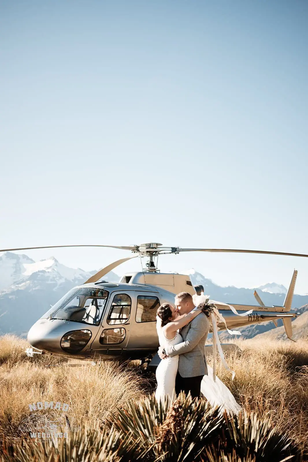 Amy & Eden embracing during their Enchanting Lake Erskine Heli Elopement Wedding.