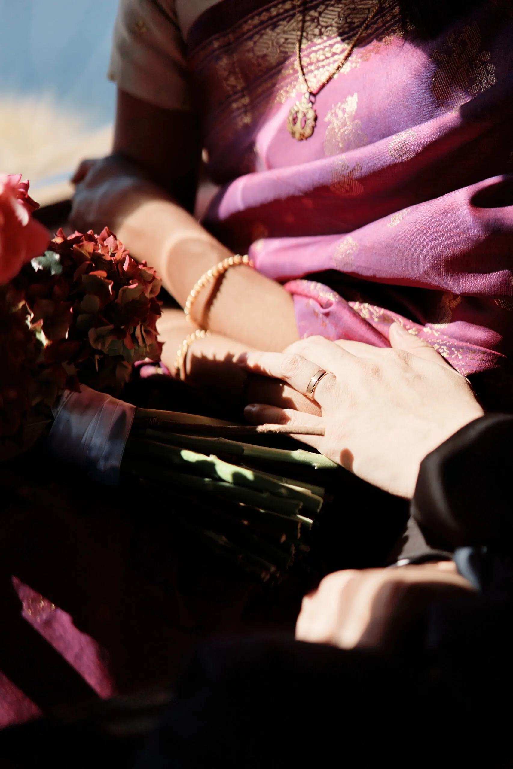 A woman wearing a purple sari.