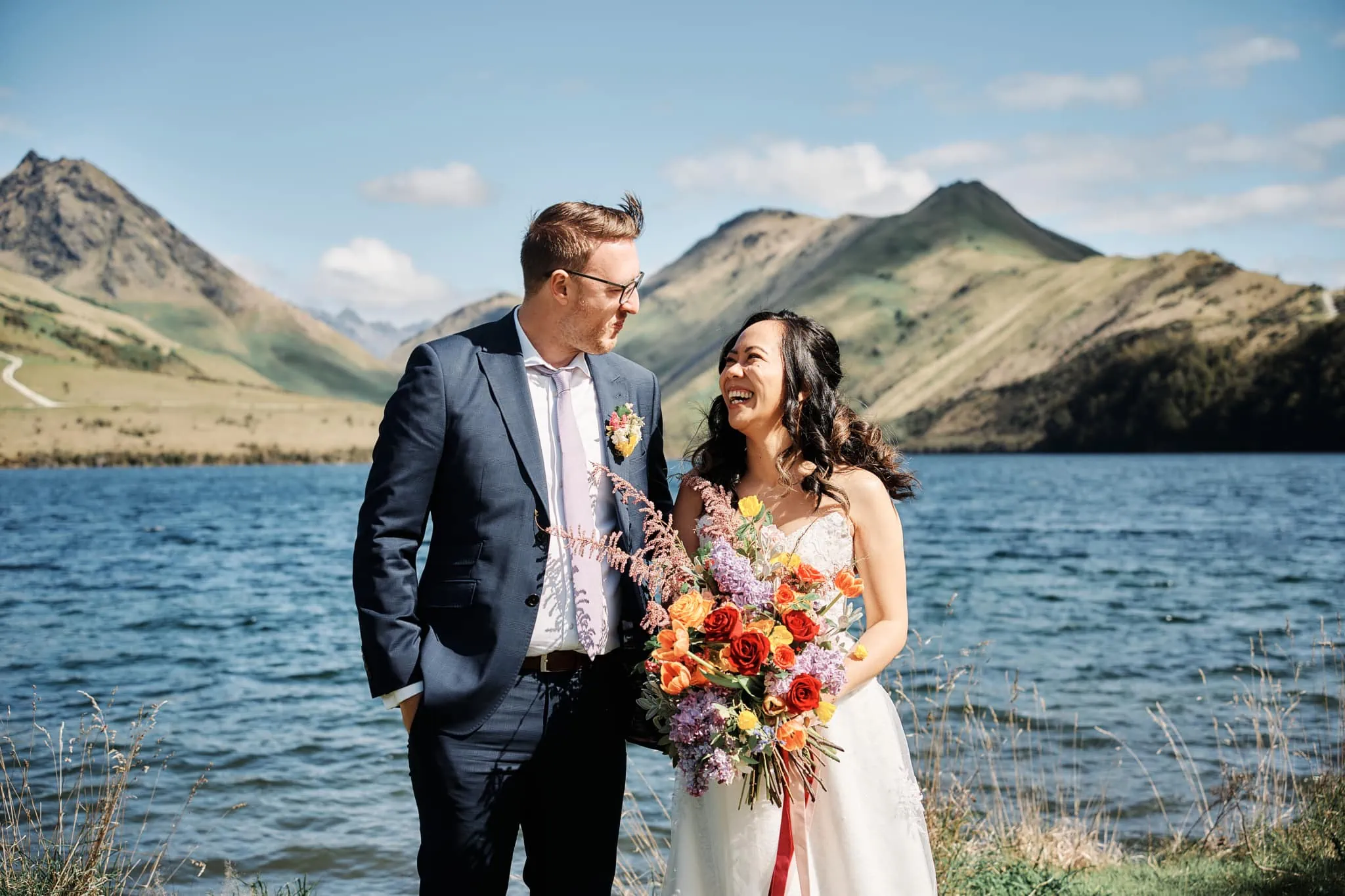 Ace and Alex's pre-wedding shoot at Moke Lake with mountains in the background.