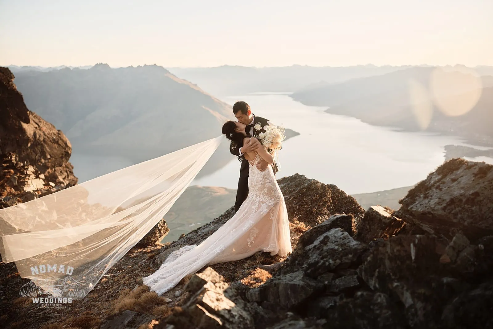 Connie and Andrew's pre-wedding shoot takes them to the top of The Remarkables, where they share a kiss overlooking Lake Wanaka.