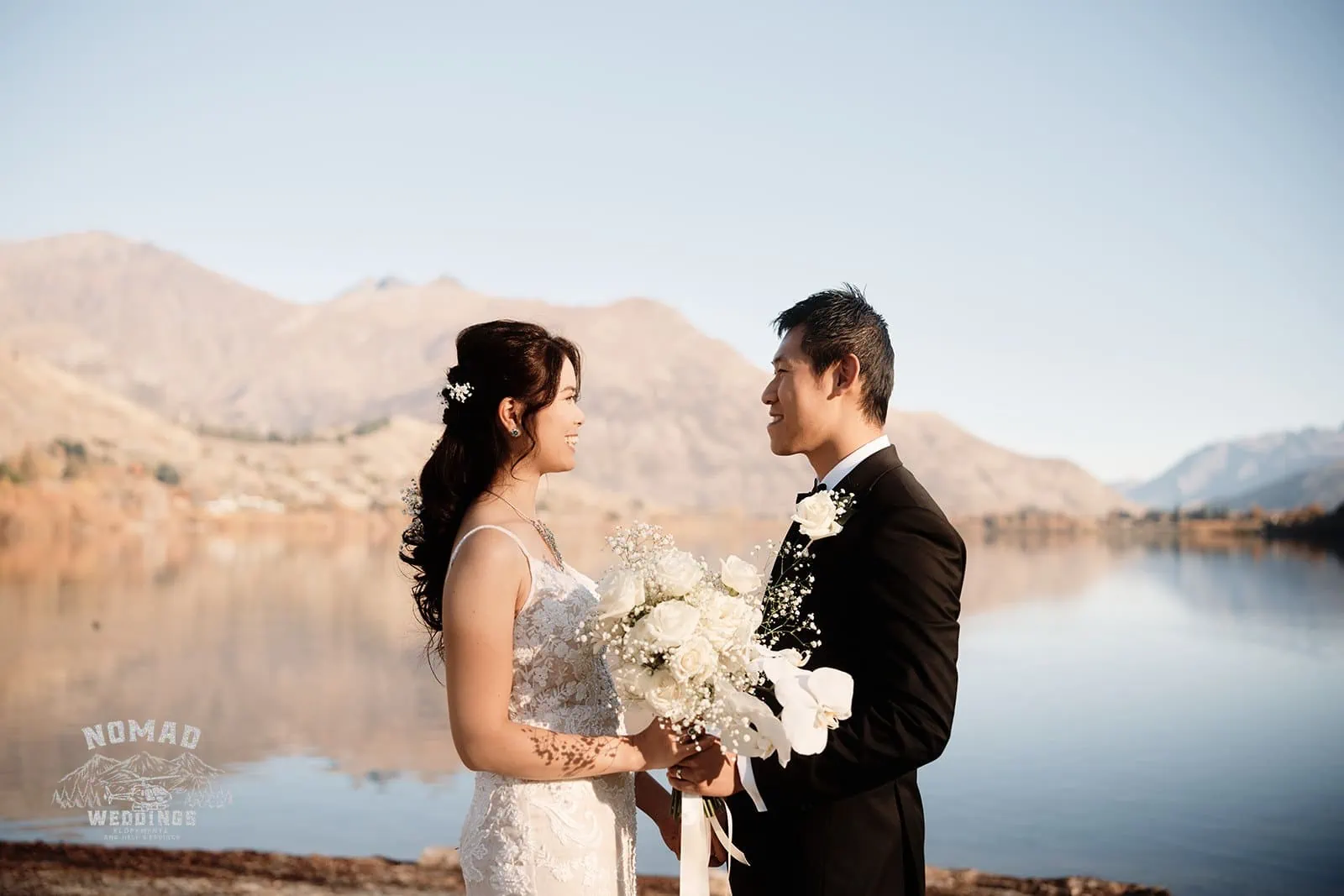 Connie and Andrew's pre-wedding shoot next to The Remarkables mountains and a lake.