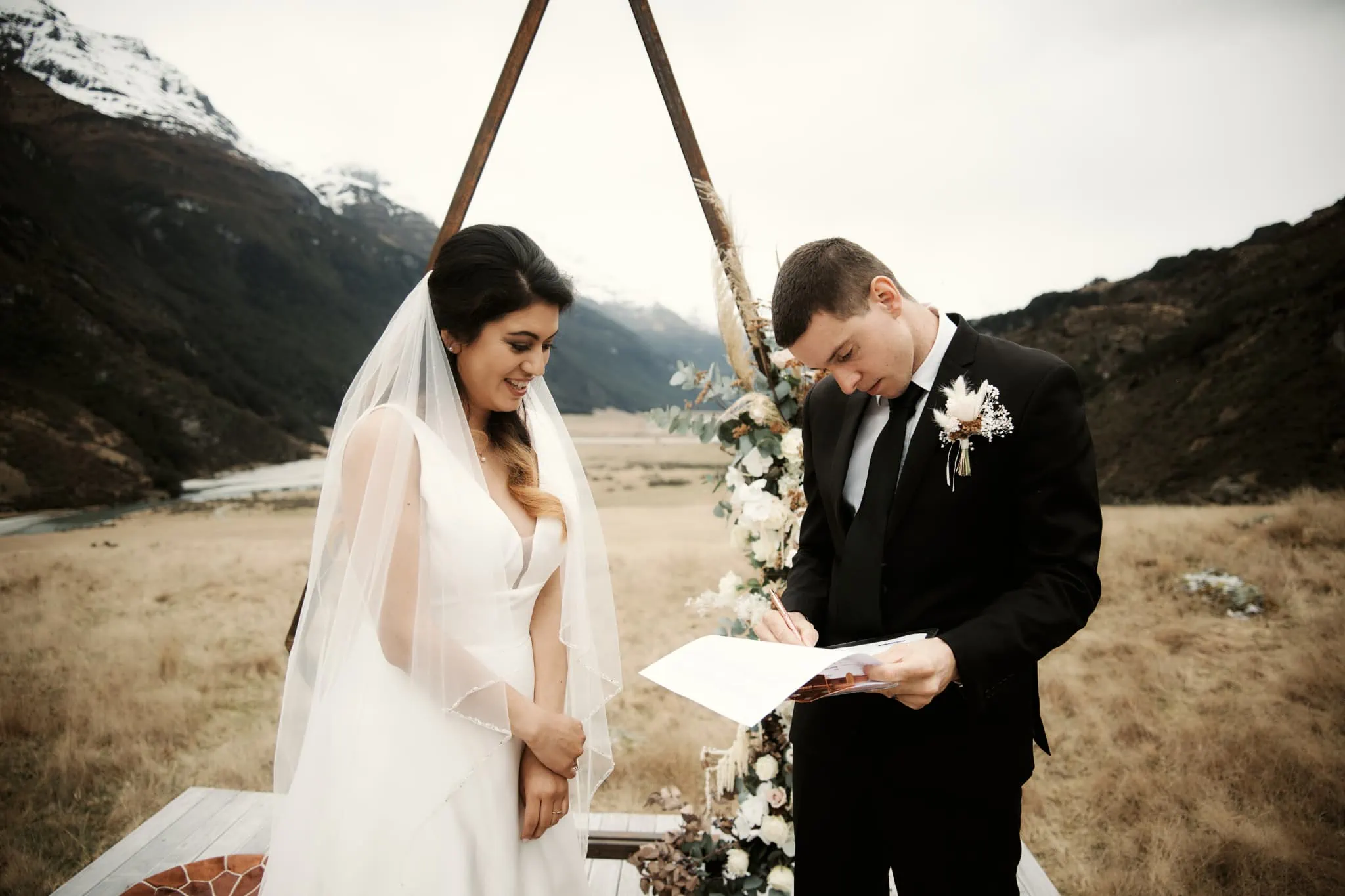 Michelle and Vedran celebrating their Rees Valley Station elopement wedding surrounded by mountains.