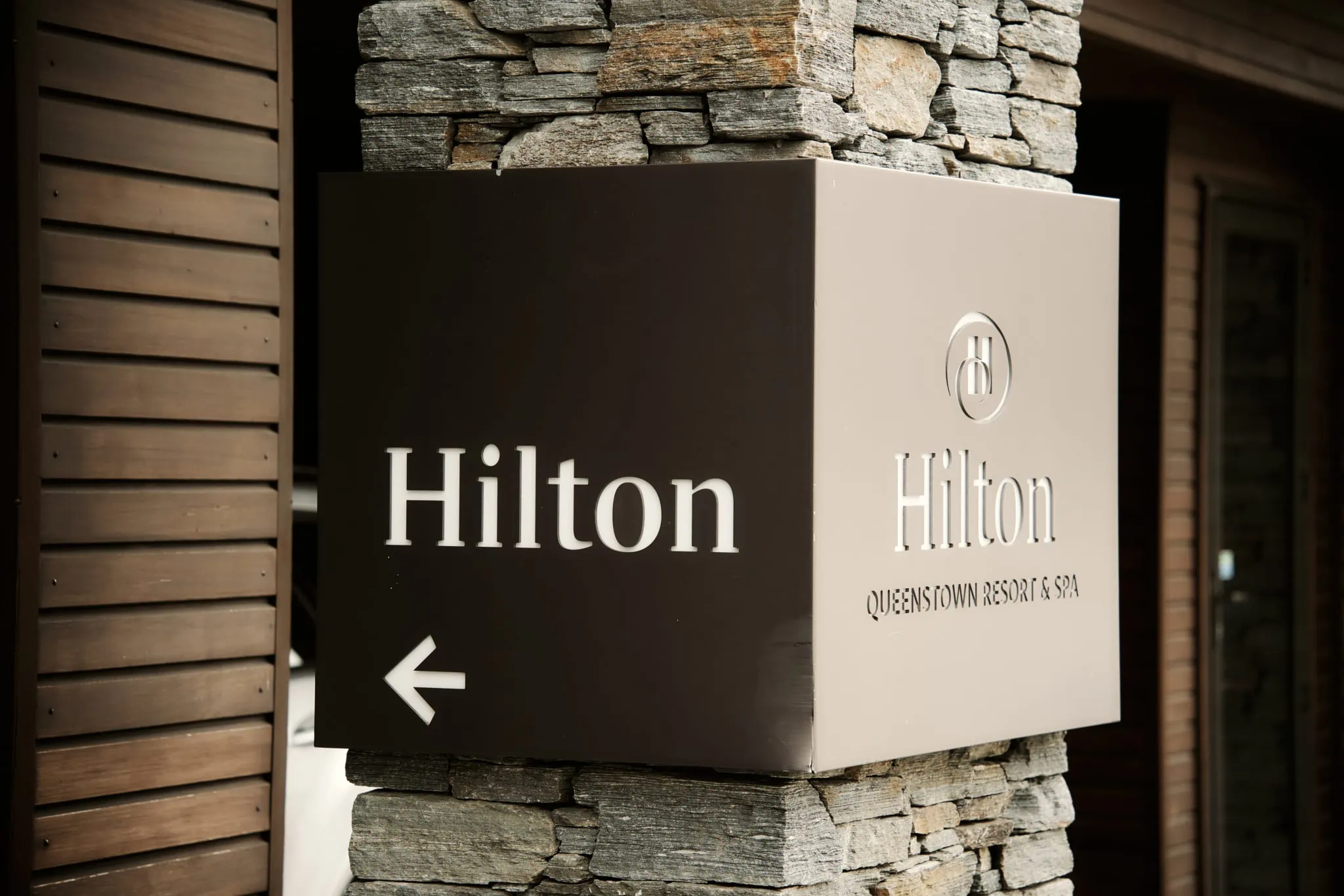A building with a Hilton sign, adorned for a Michelle and Vedran's Rees Valley Station elopement wedding.