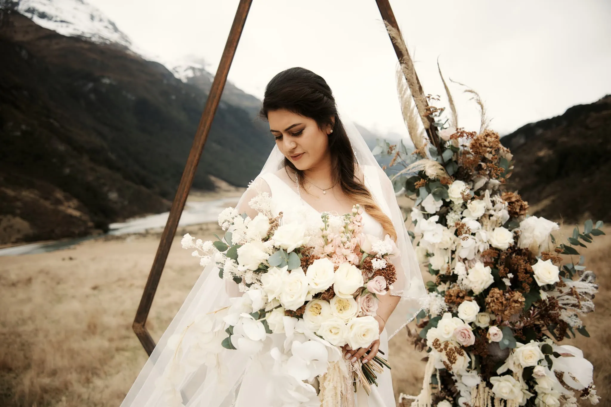 Michelle holding bouquet Mountains Rees Valley Station Elopement Wedding