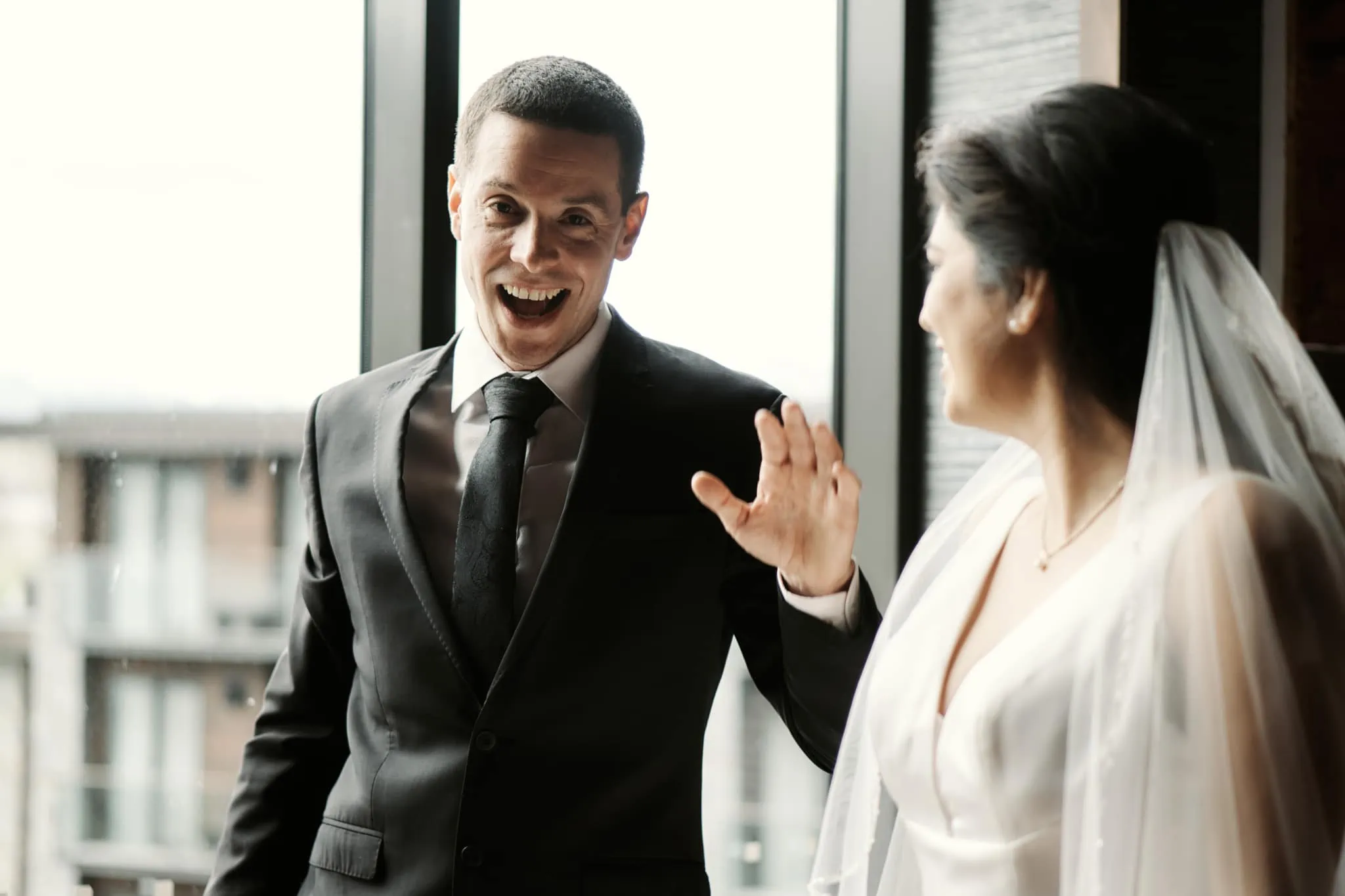 Michelle and Vedran sharing a joyous moment during their Rees Valley Station elopement wedding.