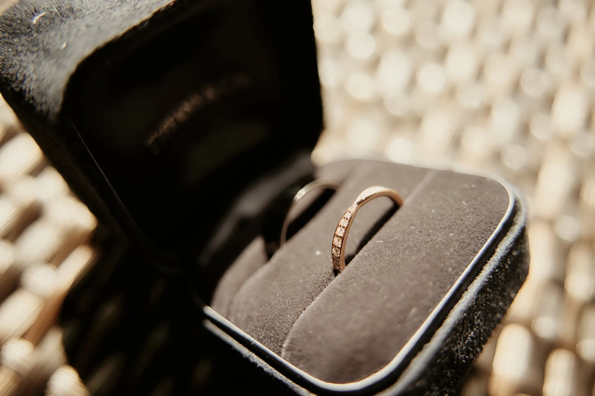 Michelle and Vedran's Rees Valley Station Elopement Wedding featured a wedding ring in a black box on a table.