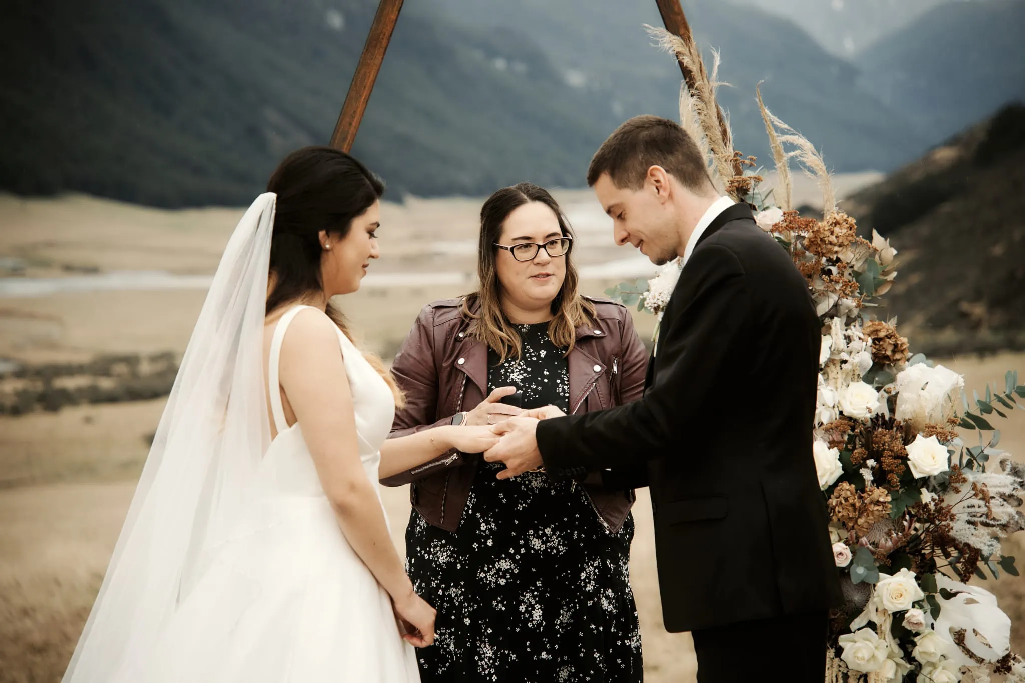 Michelle and Vedran exchange rings during their Rees Valley Station elopement wedding.
