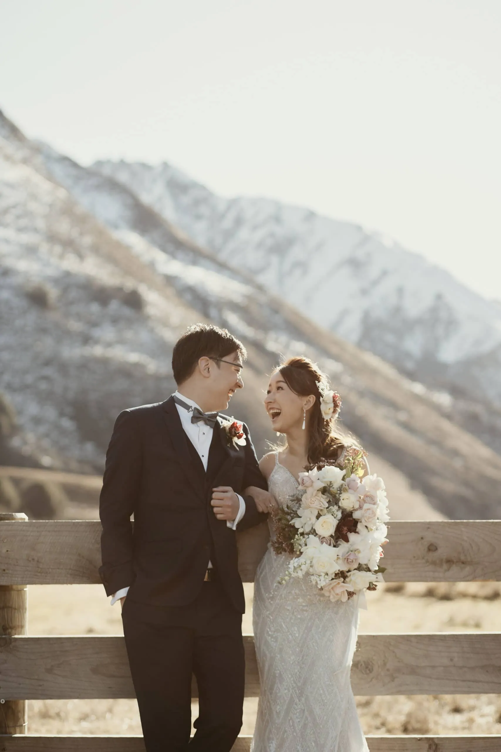 A couple eloping at The Remarkables with mountains in the background.