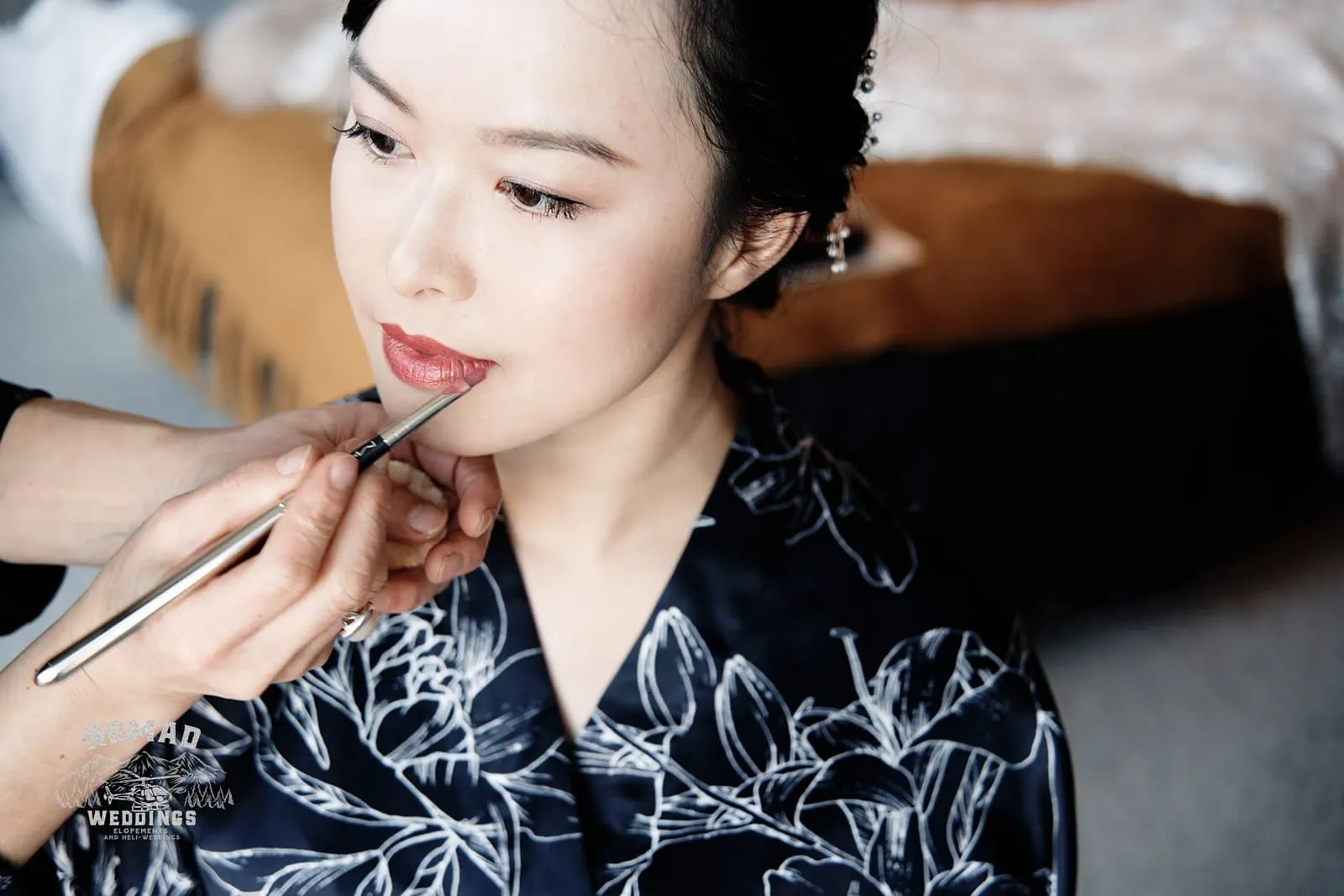 Joanna getting her makeup done in a kimono during their pre-wedding shoot in Queenstown, New Zealand.