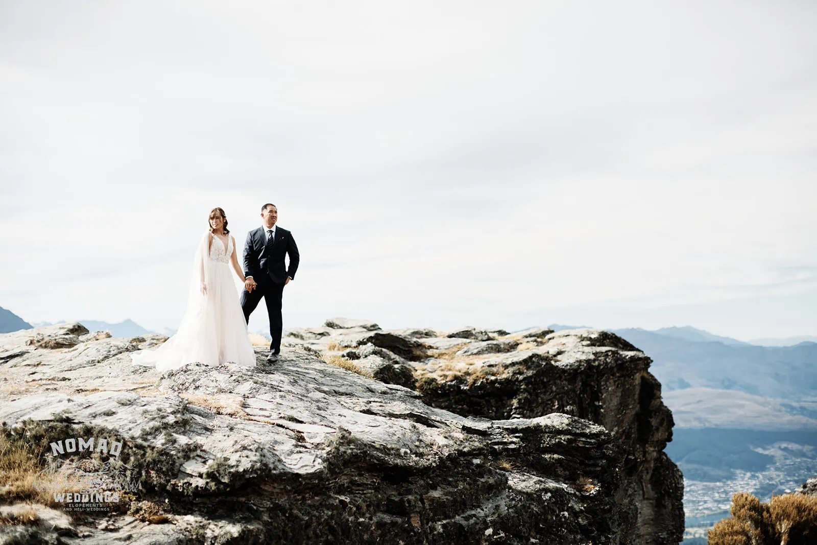 Nhi & Nicholas' Queenstown NZ Cecil Peak Pre-Wedding Shoot on a mountain top.