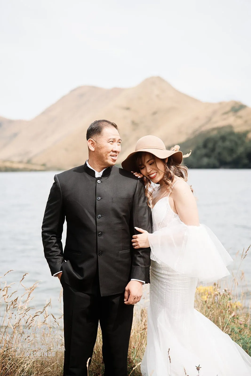 Nhi & Nicholas' Pre-Wedding Shoot in Queenstown with mountains and a lake in the background.