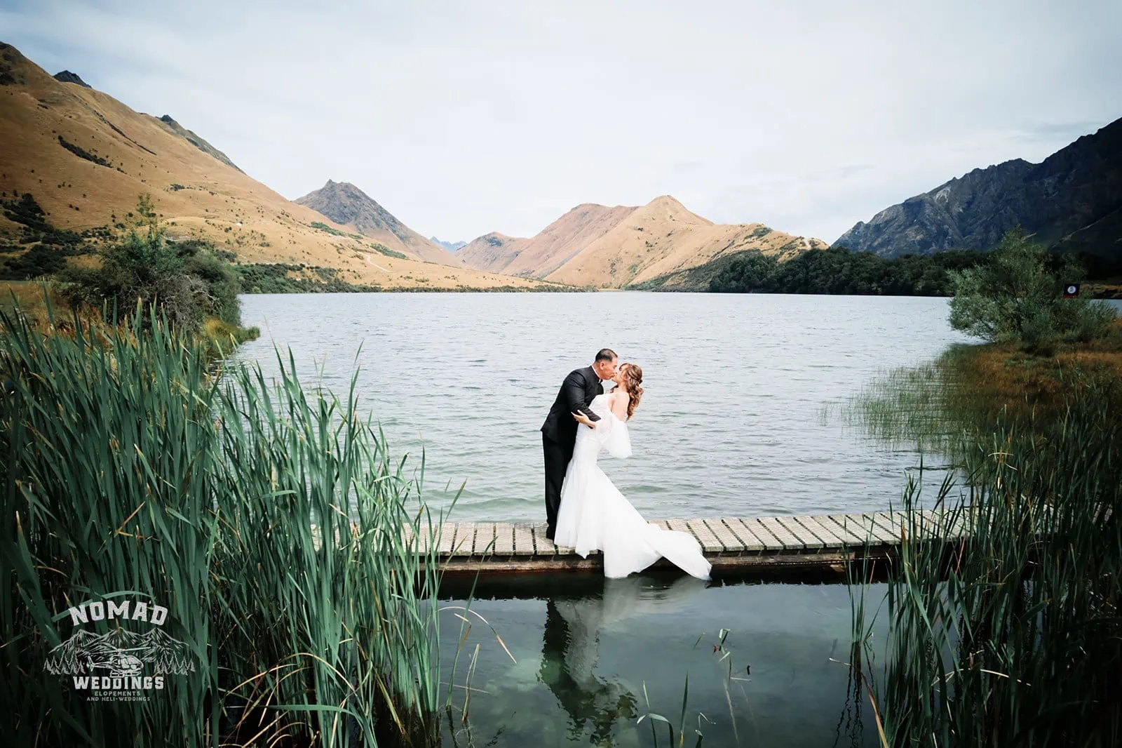 Nhi & Nicholas' pre-wedding shoot on a dock near a lake in Queenstown, New Zealand.