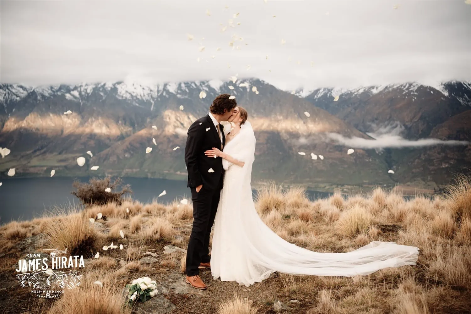 Hannah and Ross Elopement Wedding in Queenstown, New Zealand, with a mountain-top kiss.