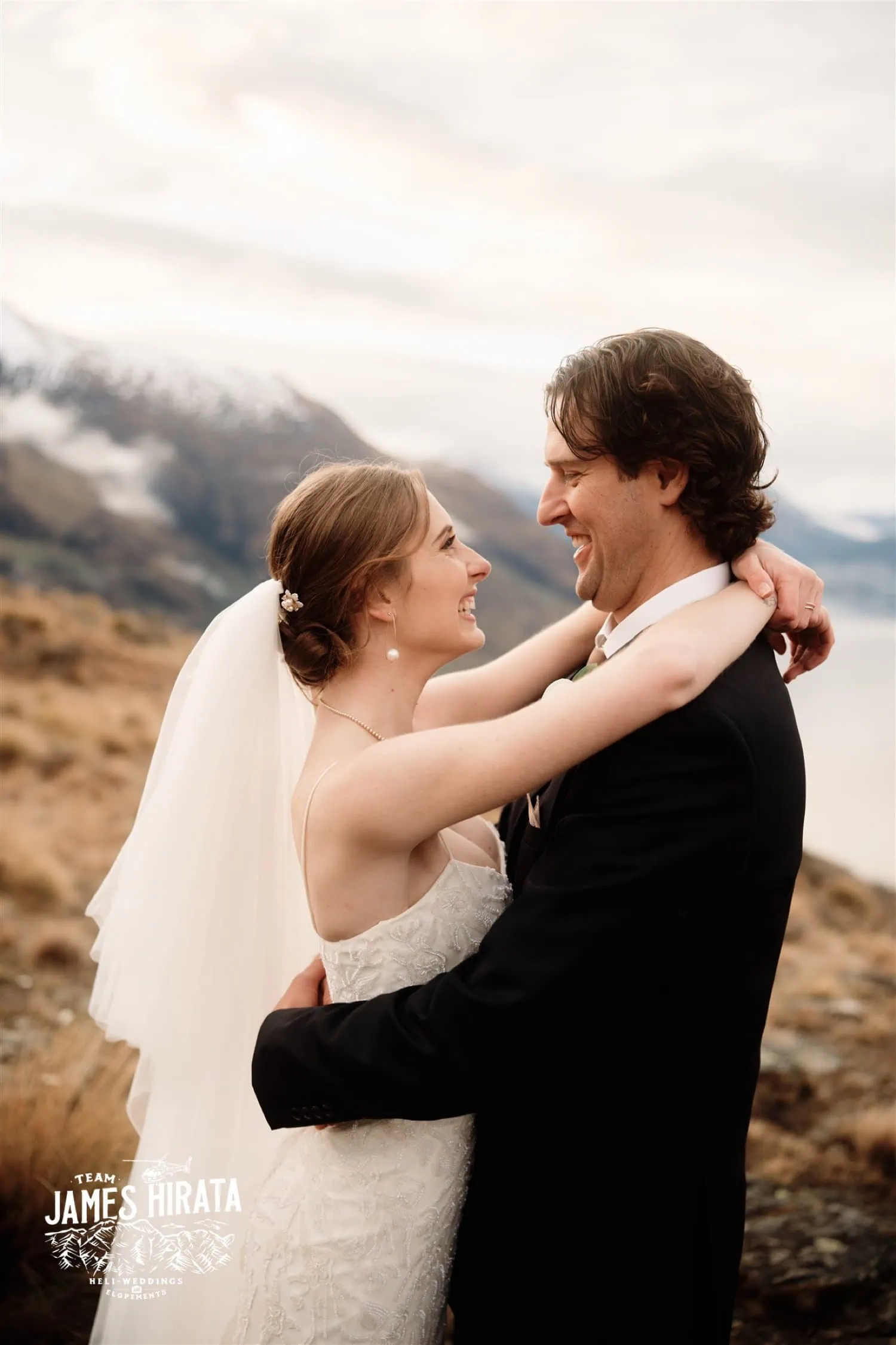 Hannah and Ross embrace during their elopement wedding atop the Bayonet Peaks