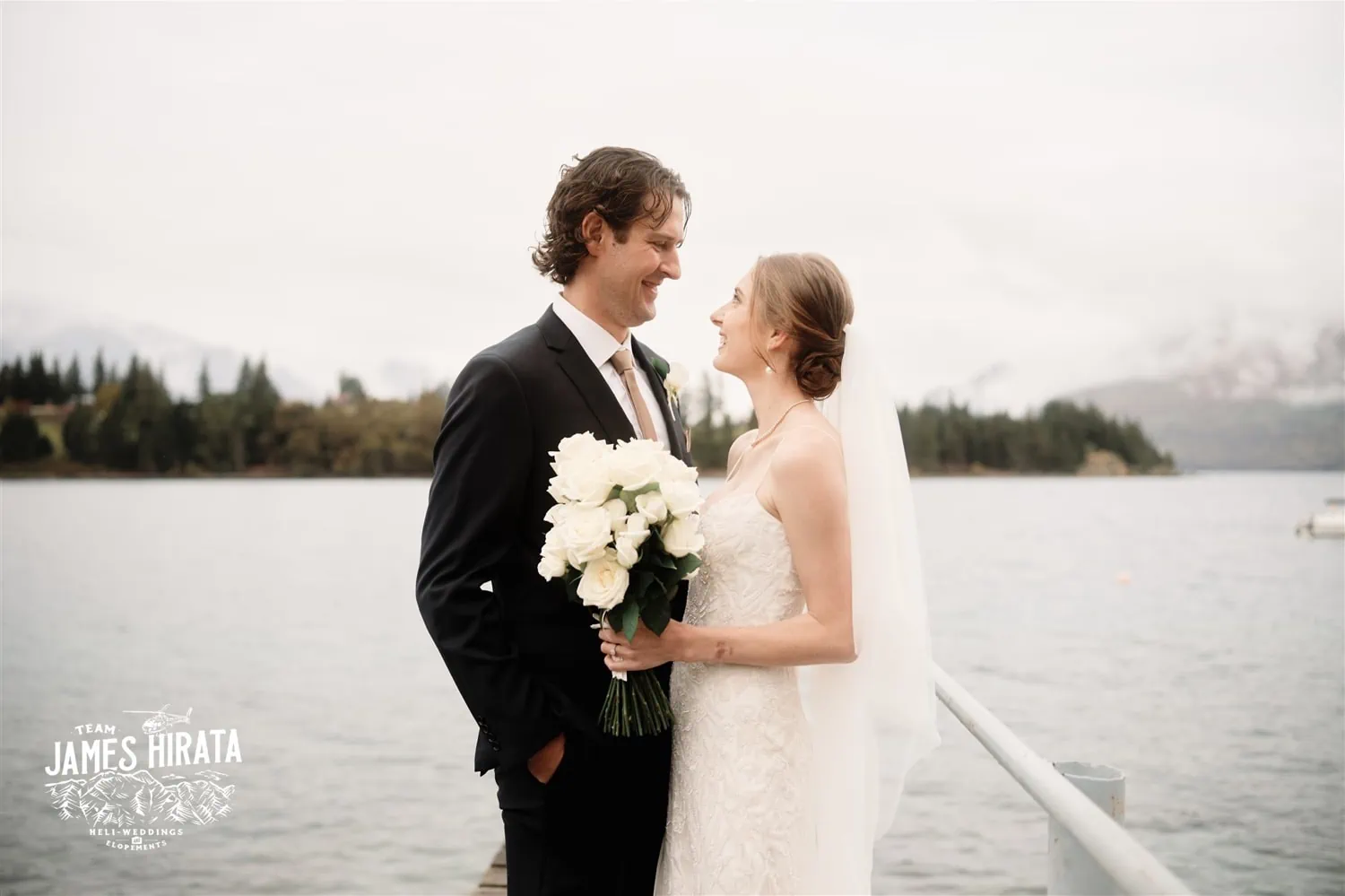 Hannah and Ross Elopement Wedding at a dock near a lake in Queenstown, New Zealand.
