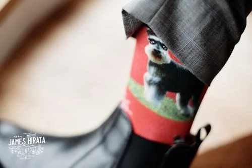 A pair of socks featuring a schnauzer for Regan & Jake's Queenstown elopement wedding.