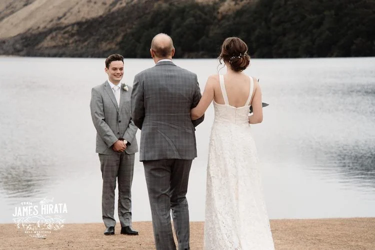 Regan & Jake elope in Queenstown for their wedding ceremony next to a lake.