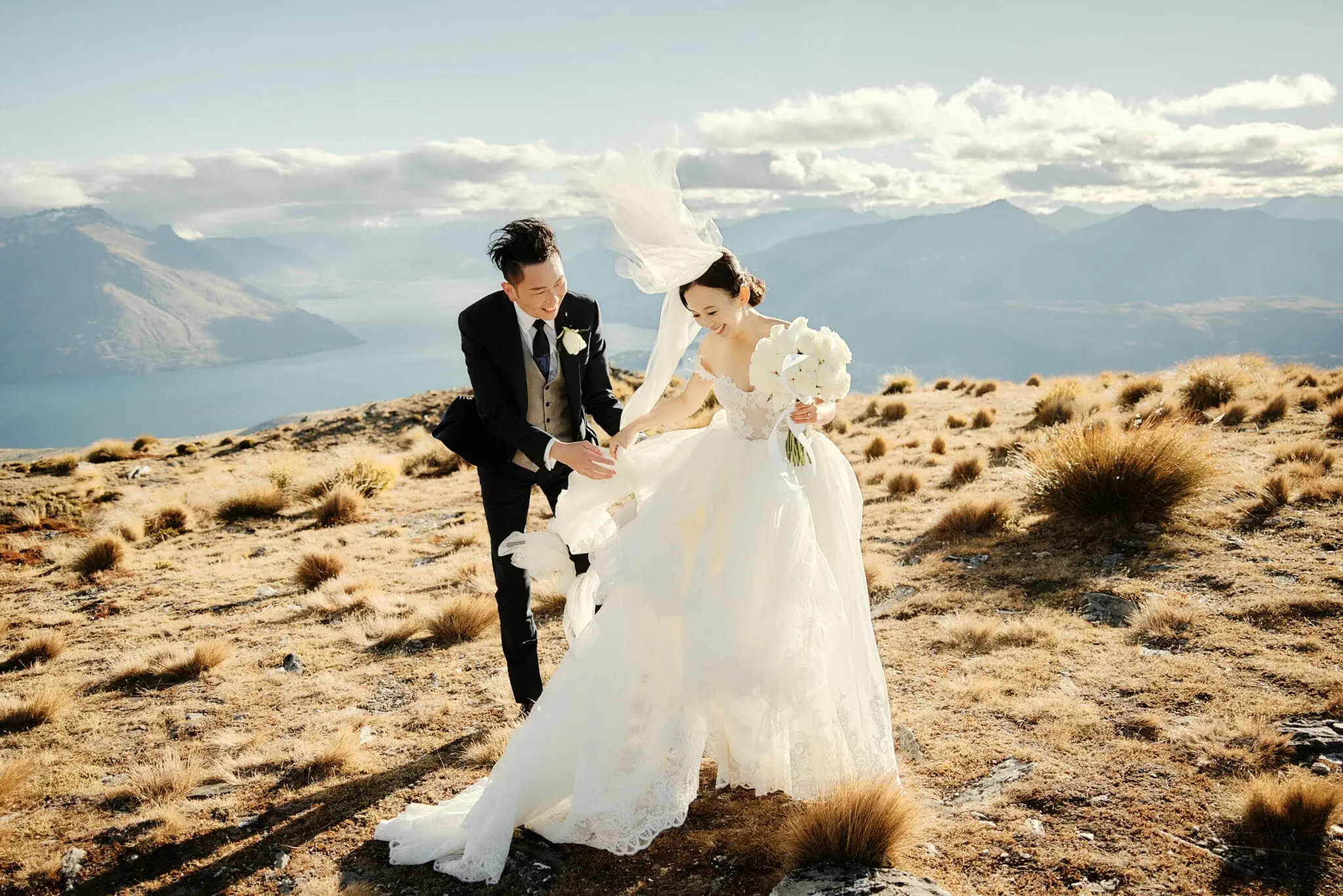 Queenstown New Zealand Elopement Wedding Photographer - Sarah and Tim's scenic Queenstown heli elopement wedding on top of a mountain in New Zealand.